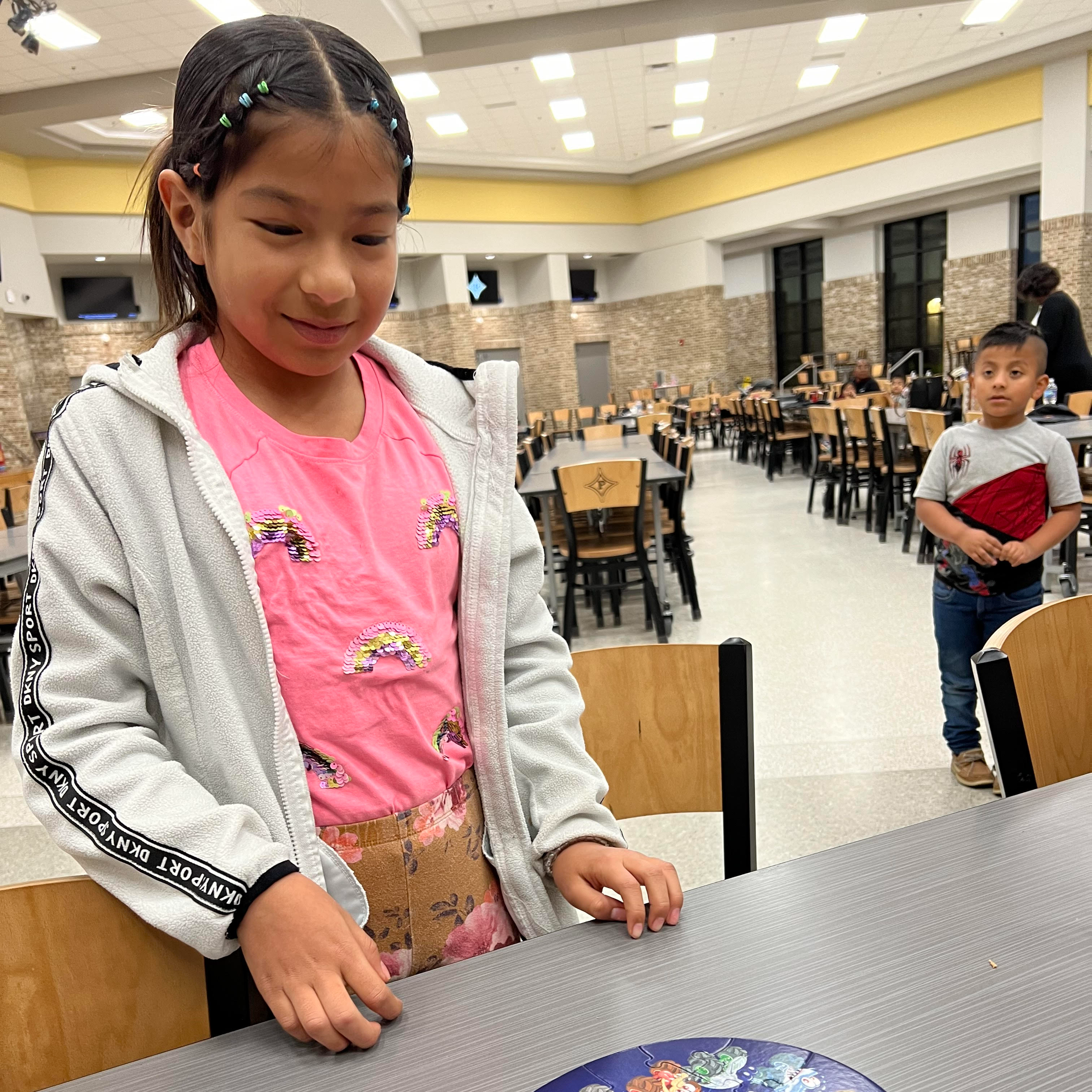 student waits patiently after completing a puzzle.