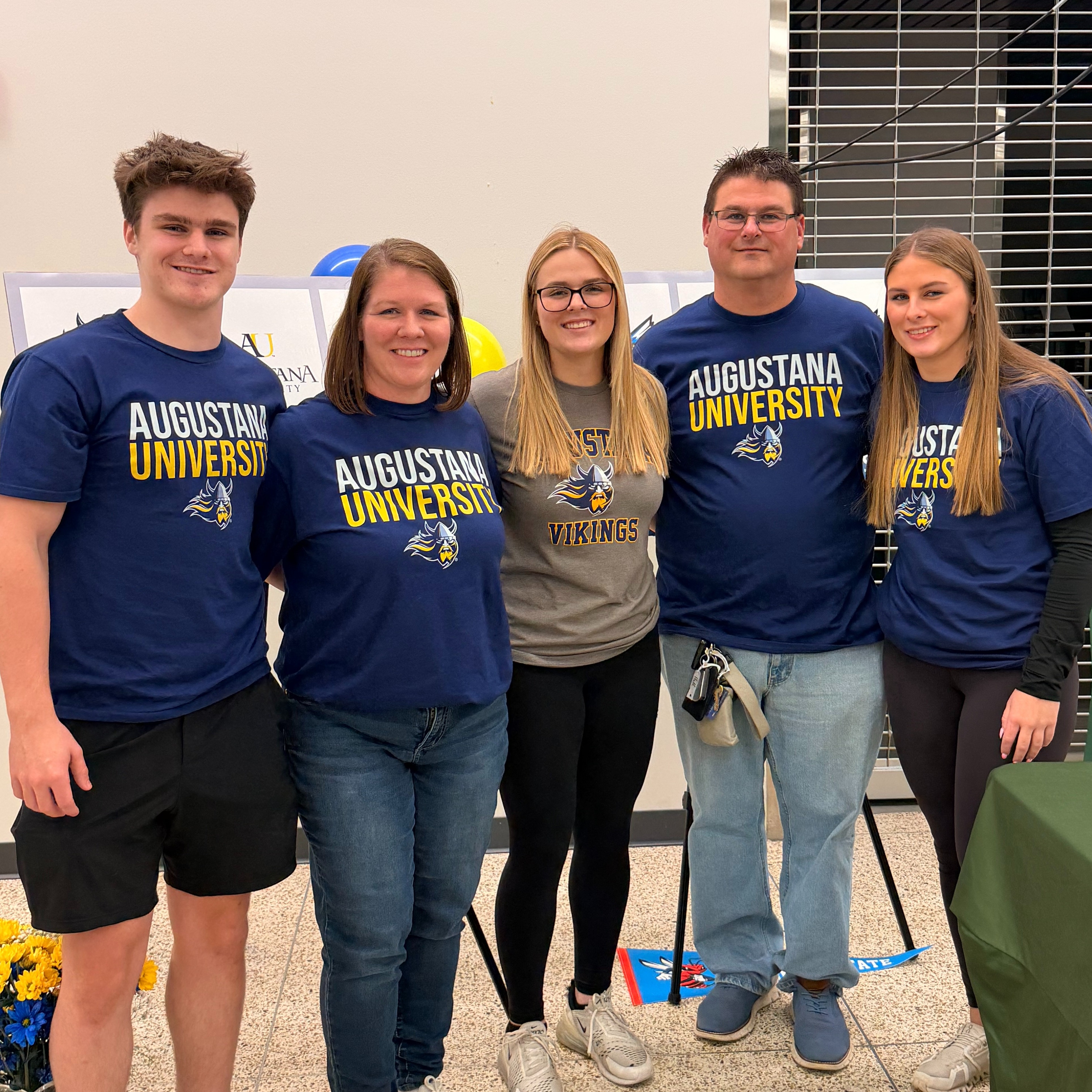 Ms. Hall smiling with her family