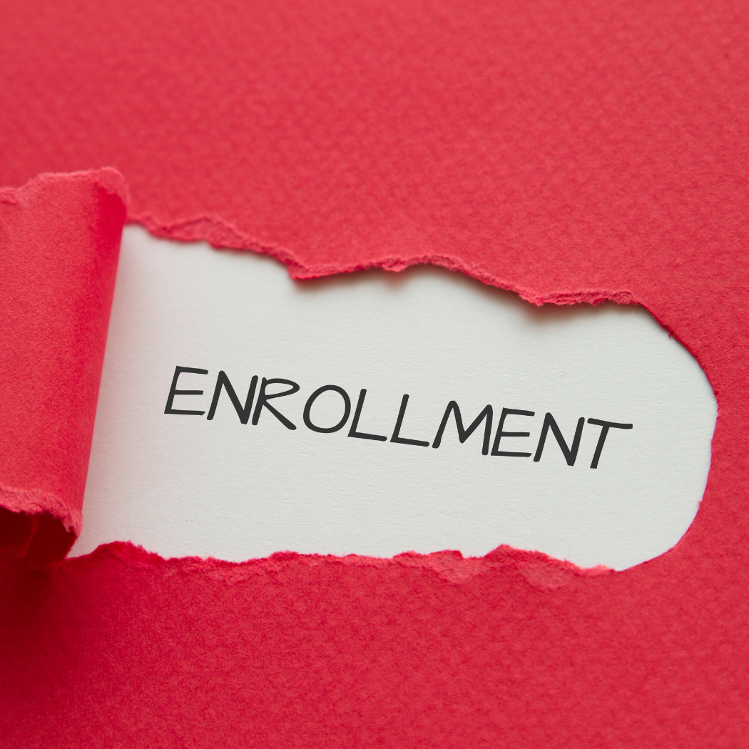 the word enrollment is behind a torn piece of red paper