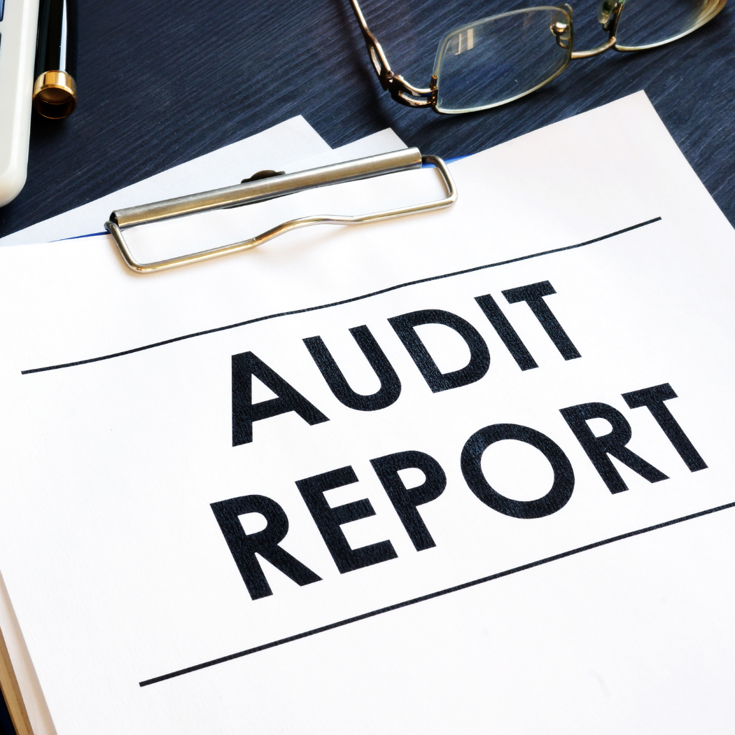 the words audit report on a piece of paper