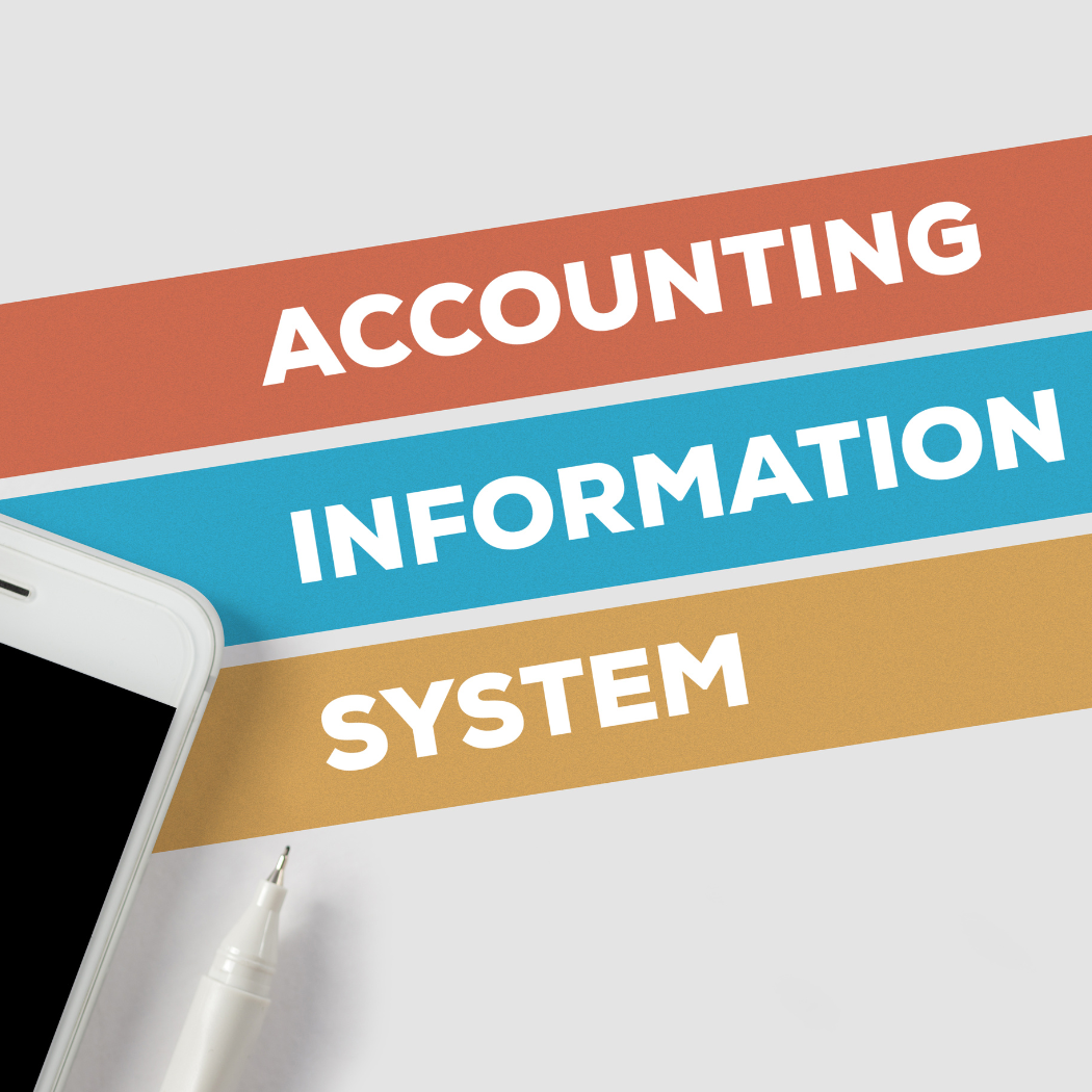 the words accounting information system on a piece of. paper next to a mobile phone