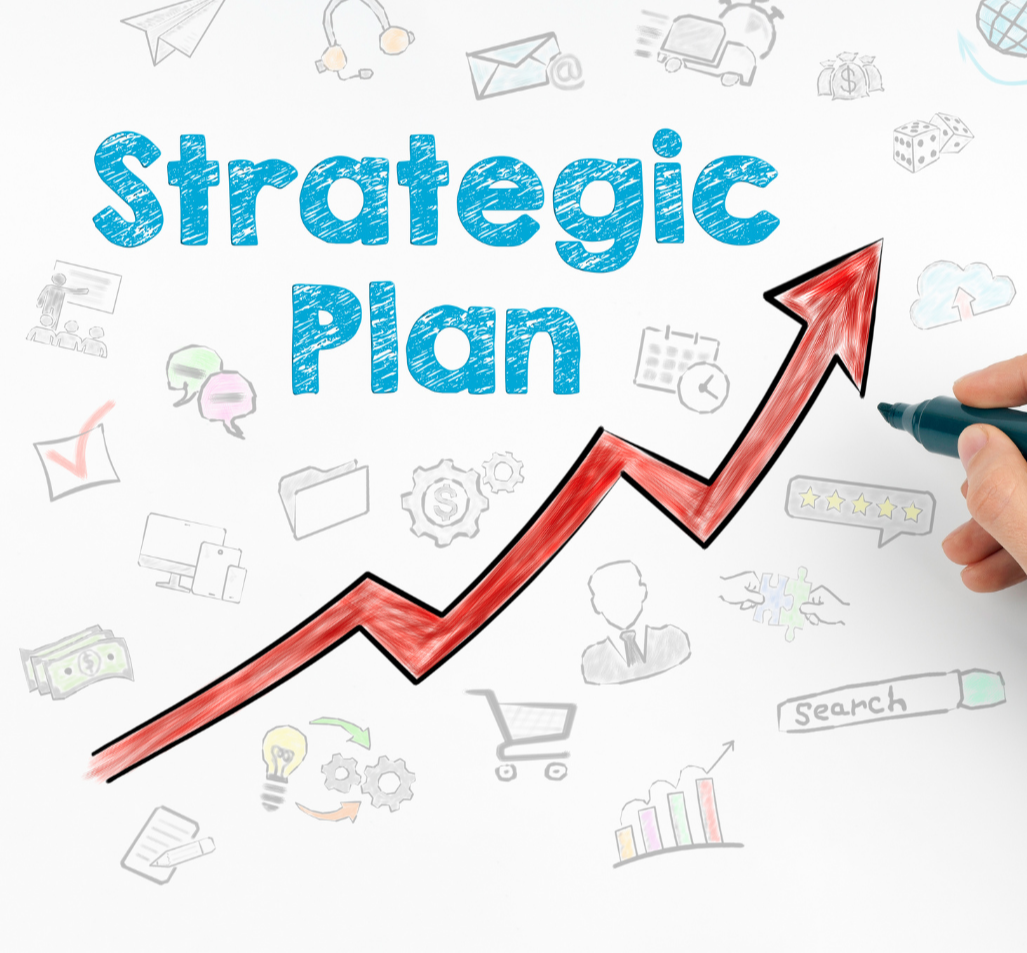 a hand holds a marker that is drawing an arrow pointing up. the words strategic plan are above the arrow