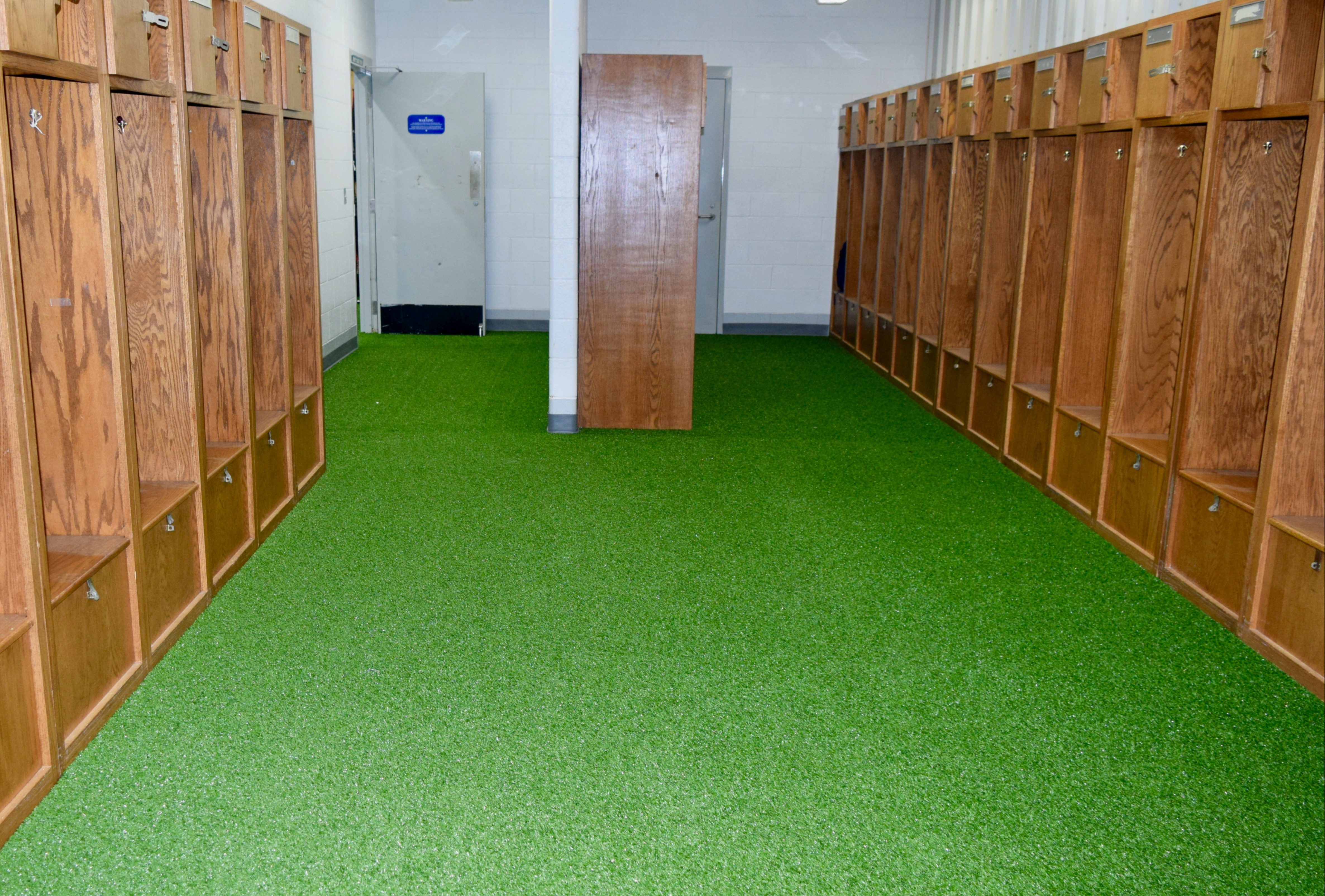 a dressing room with turf floor