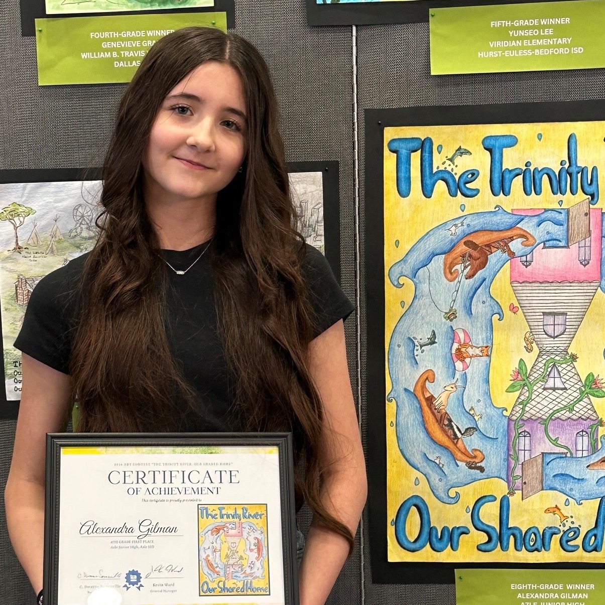Student holding art