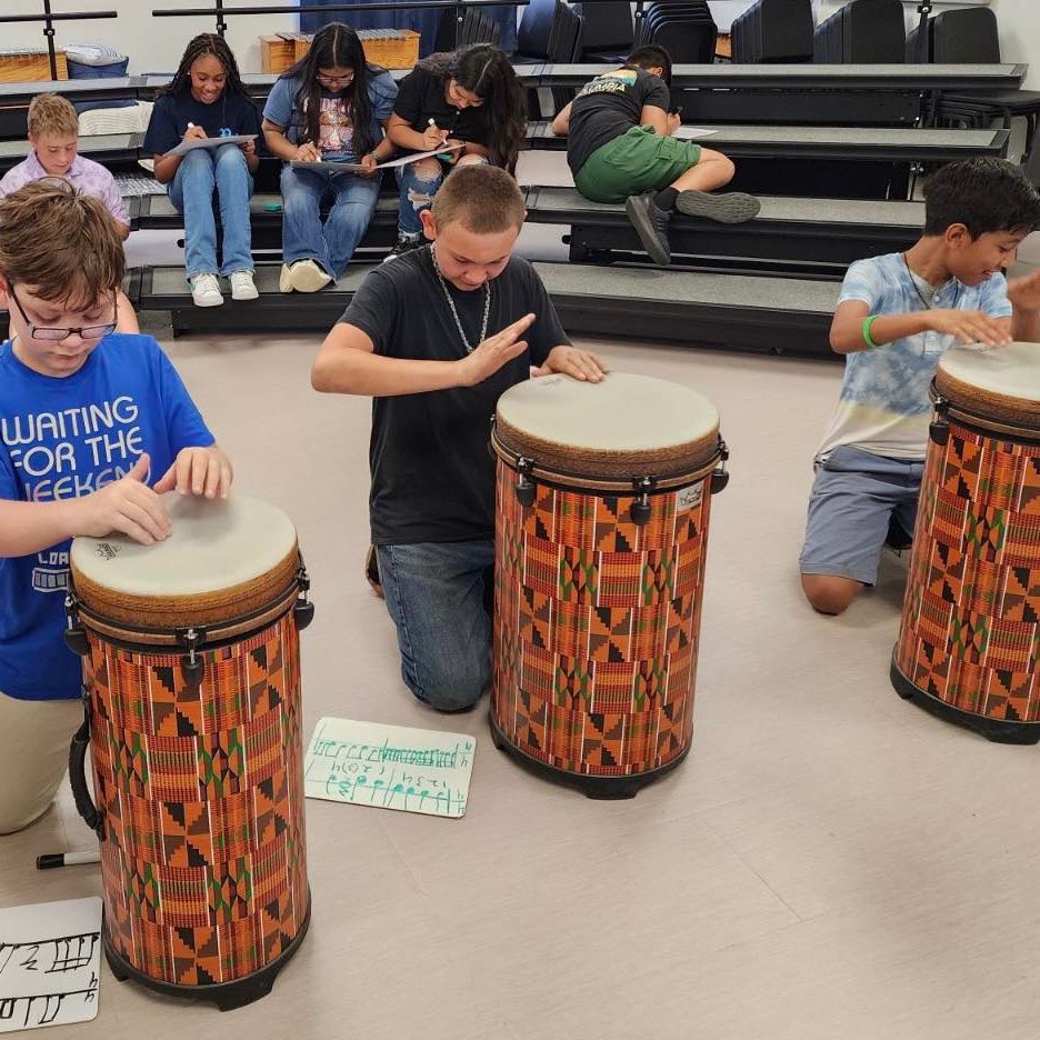 Kids banging on drums