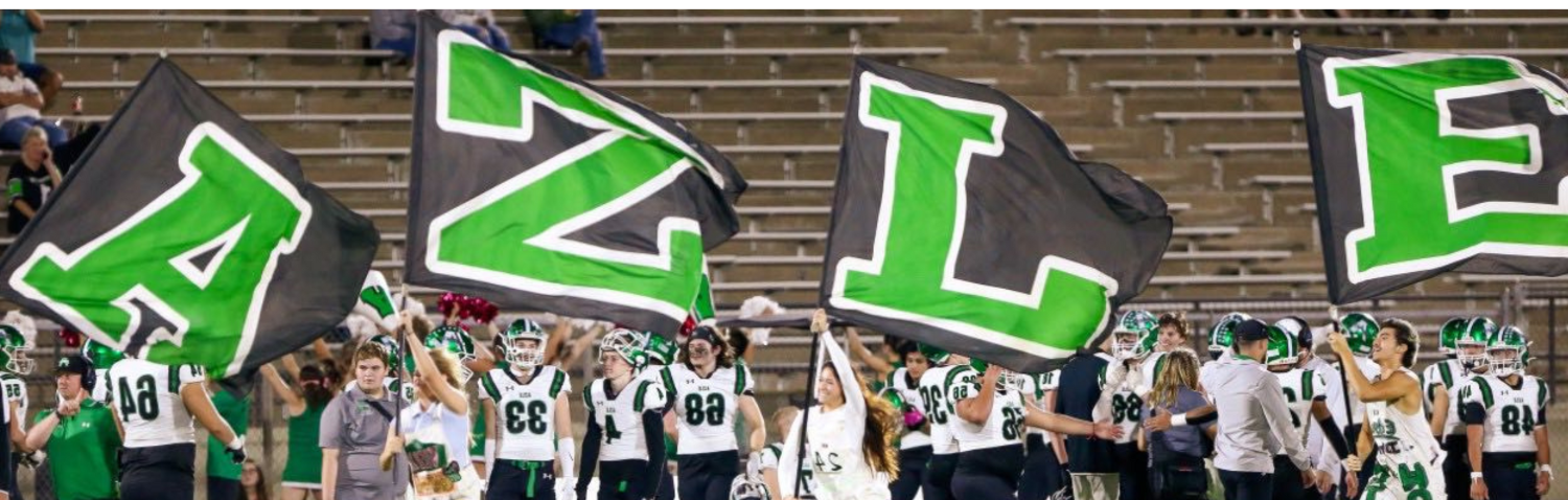 Students running across football field carrying AZLE Flags