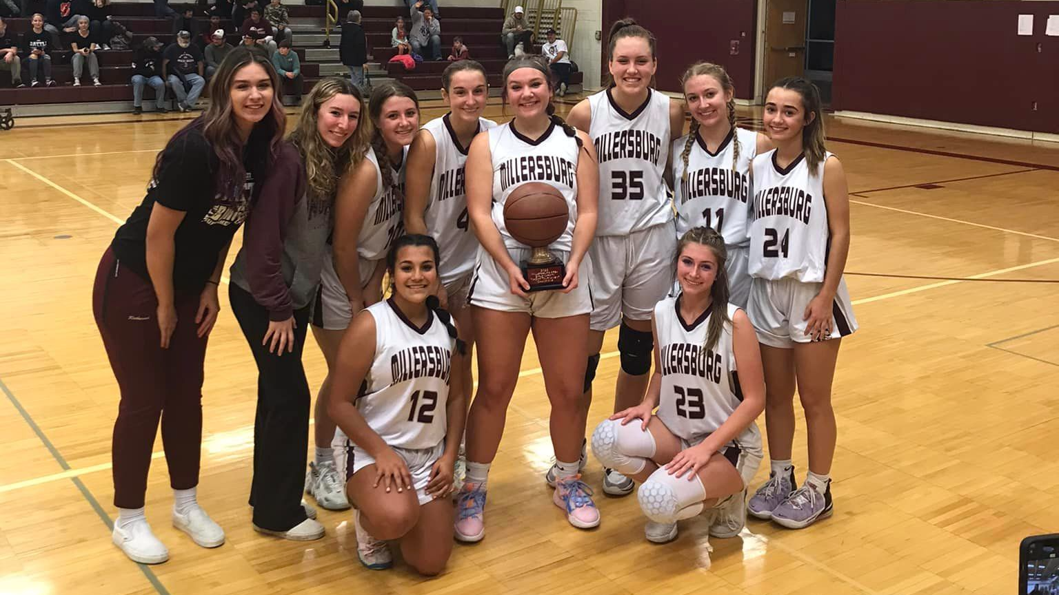 High School girls basketball team standing