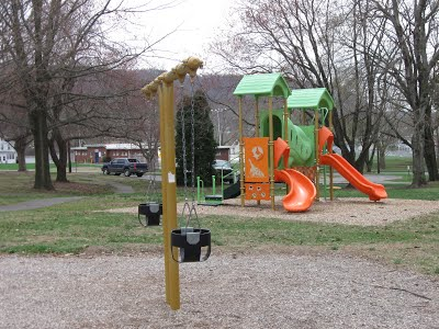 playground equipment with slides and swings