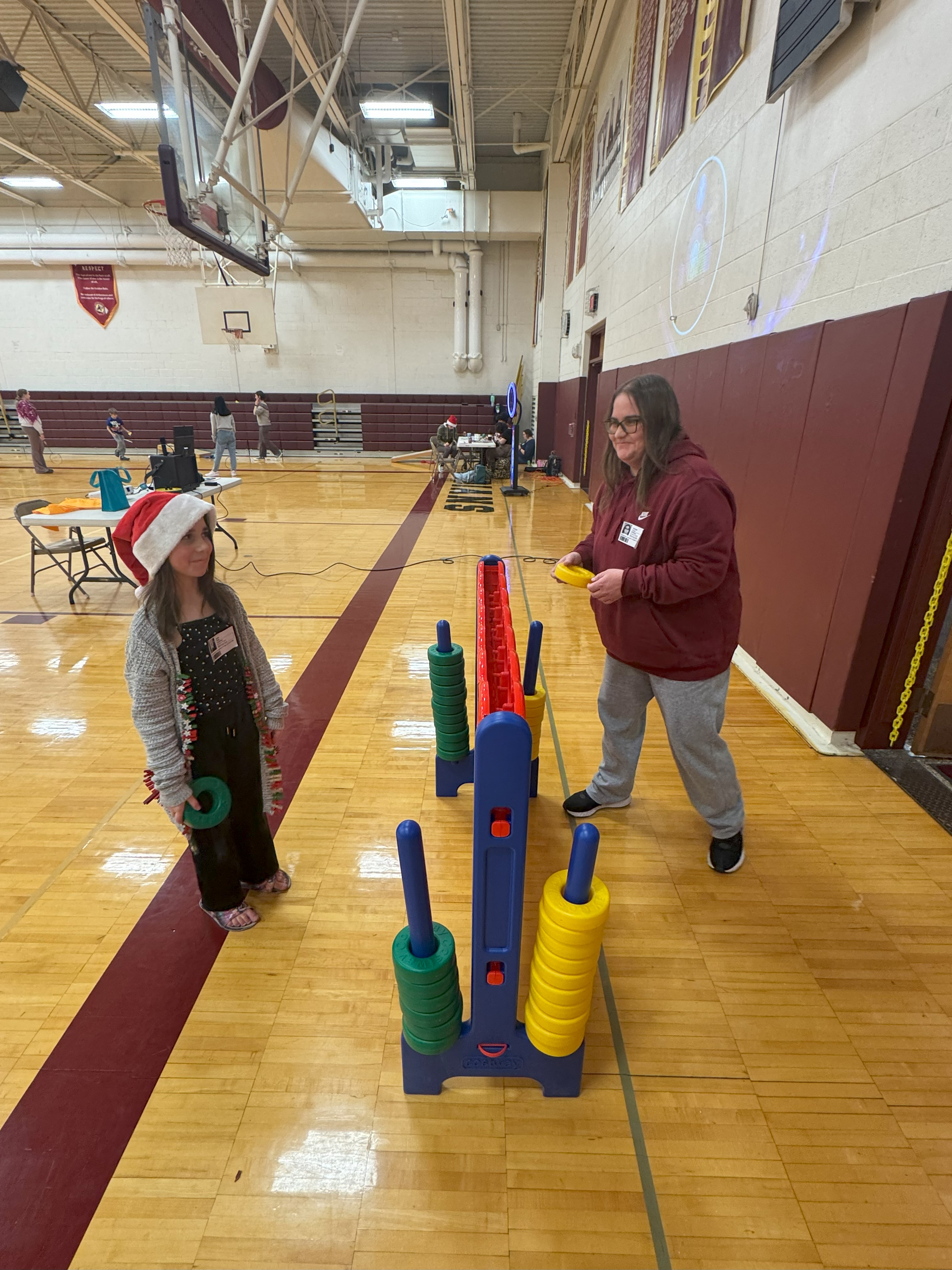 staff and students playing ring toss