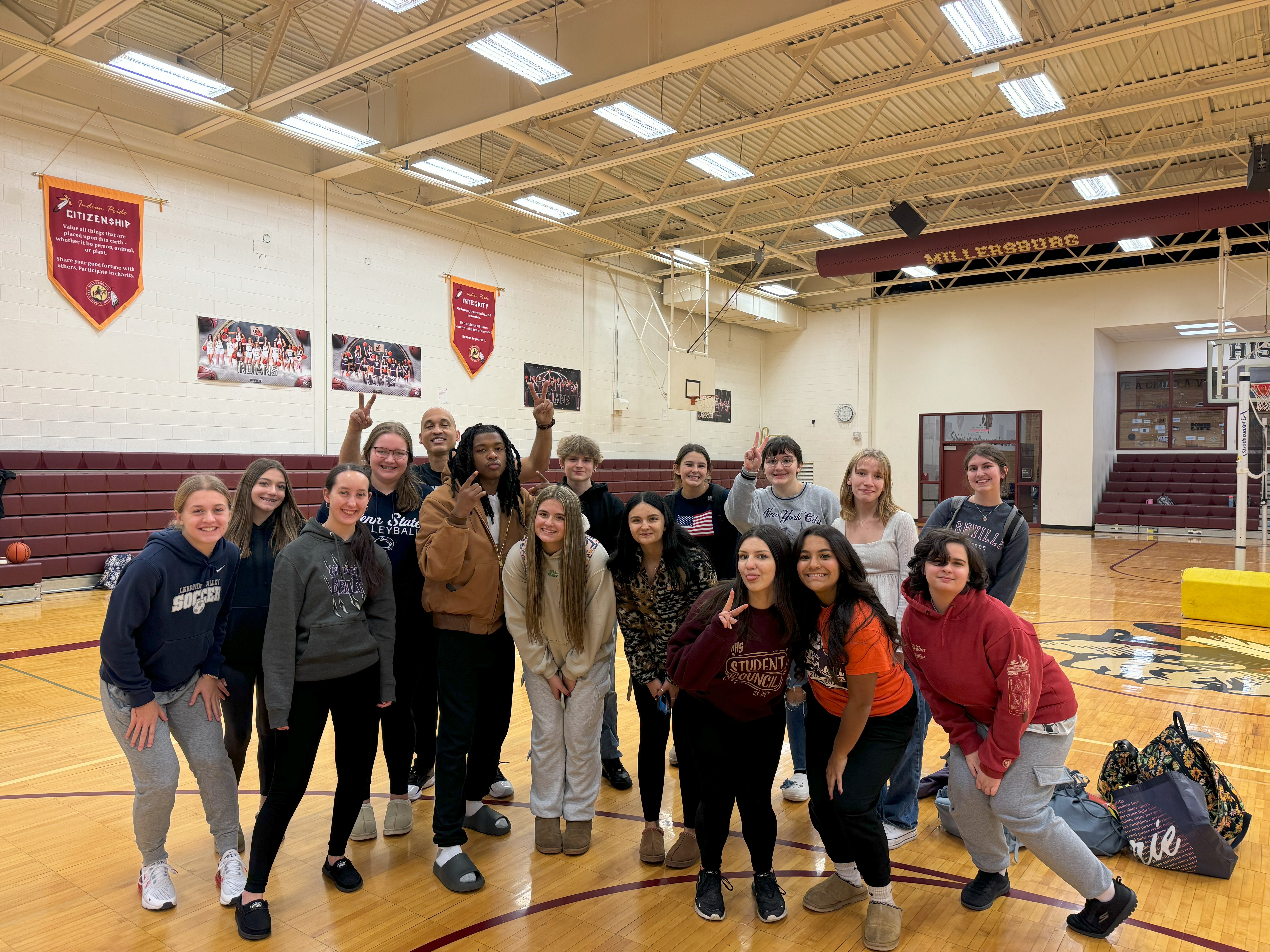 staff and students standing in gym