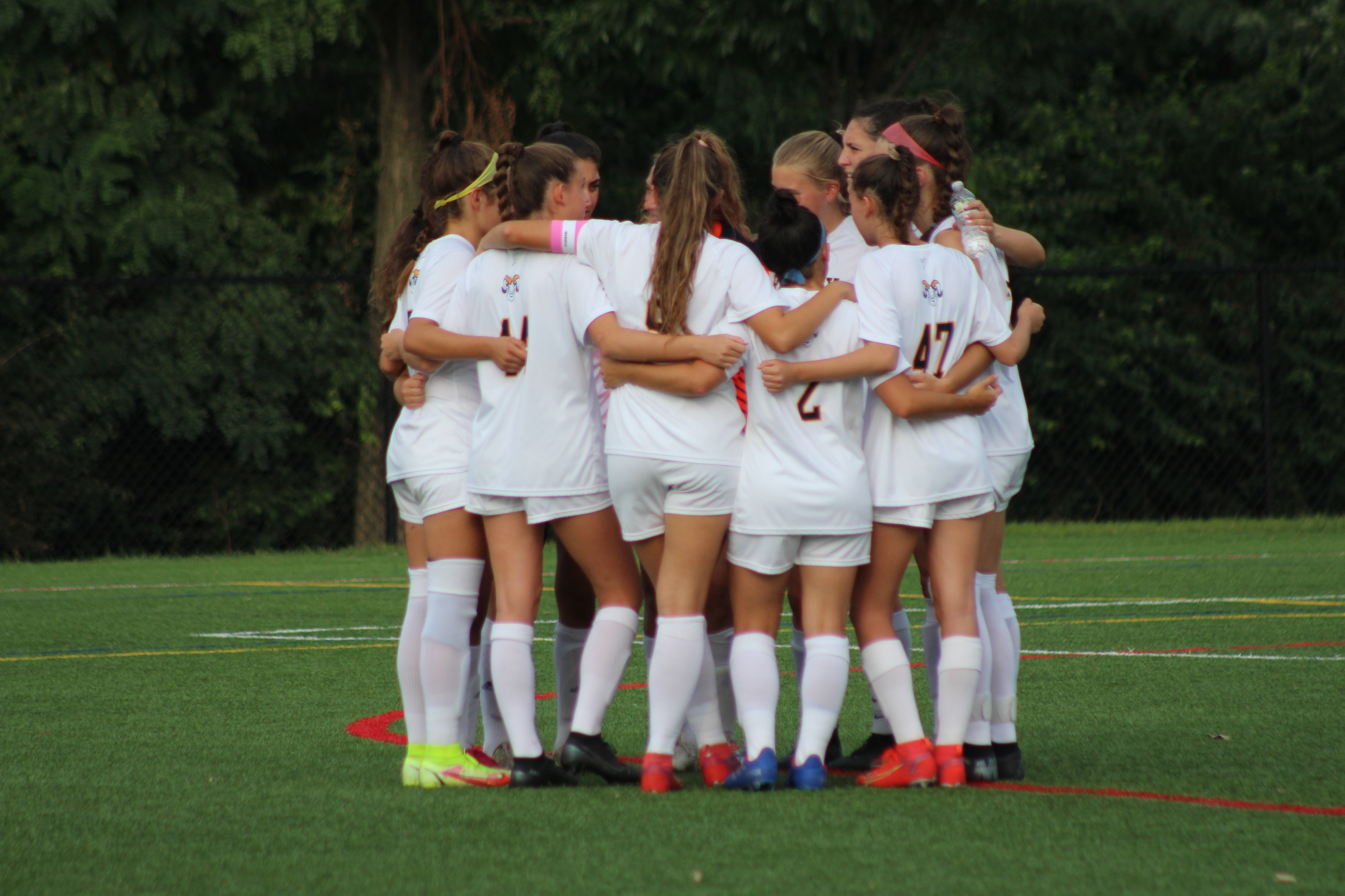 Ramsey women's soccer team huddles up before the game.