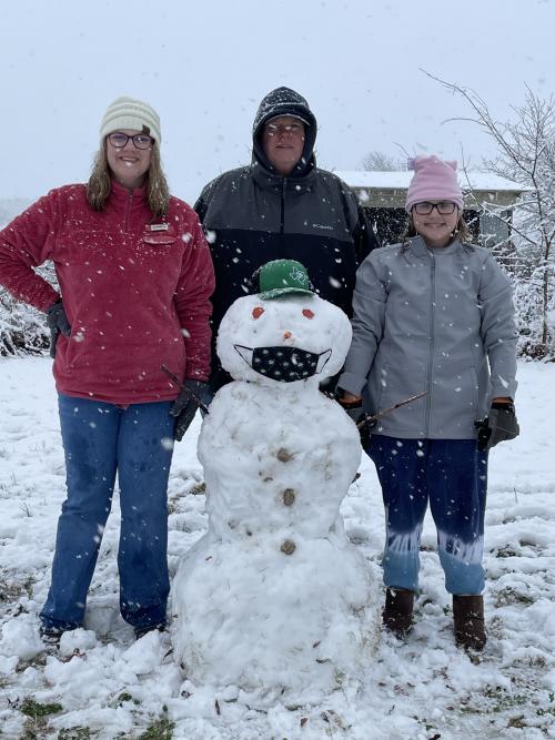 Martin Brumit and his family with a snowman
