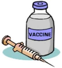 Vaccine bottle with a syringe next to it