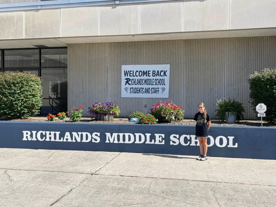 Student in front of Richlands Middle School.