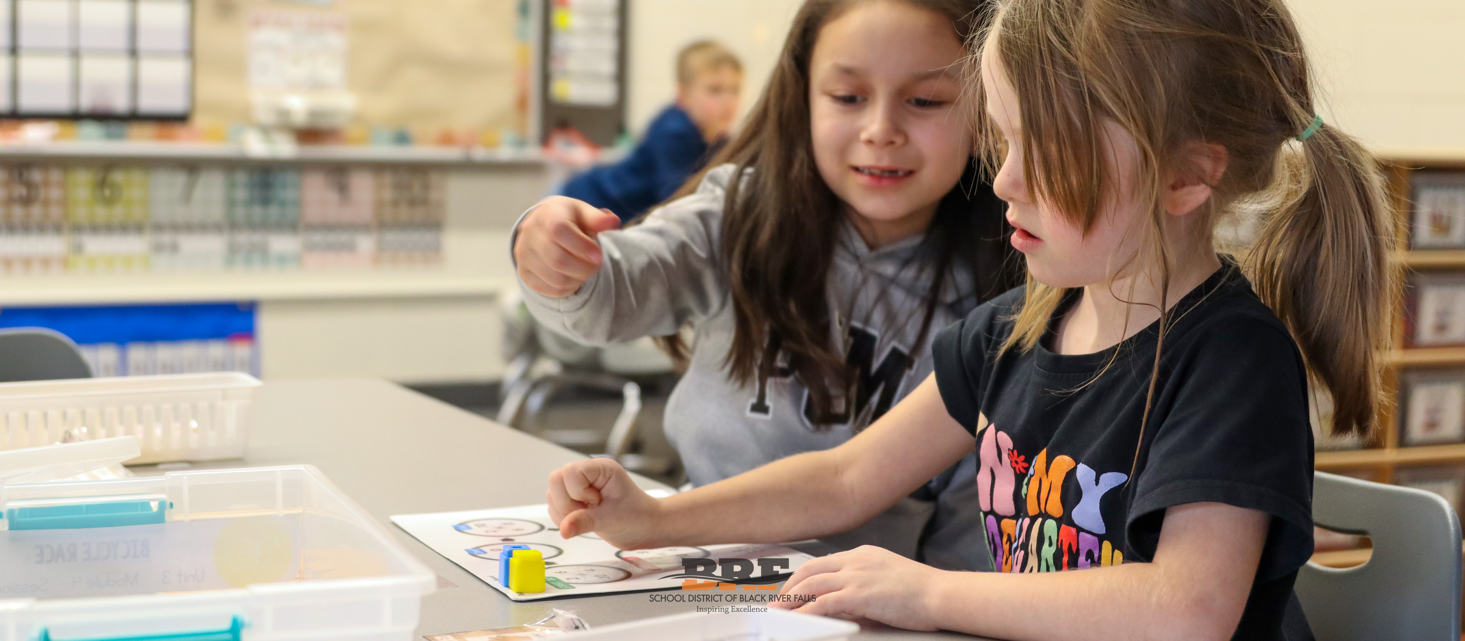 Girl plays with math manipulatives.