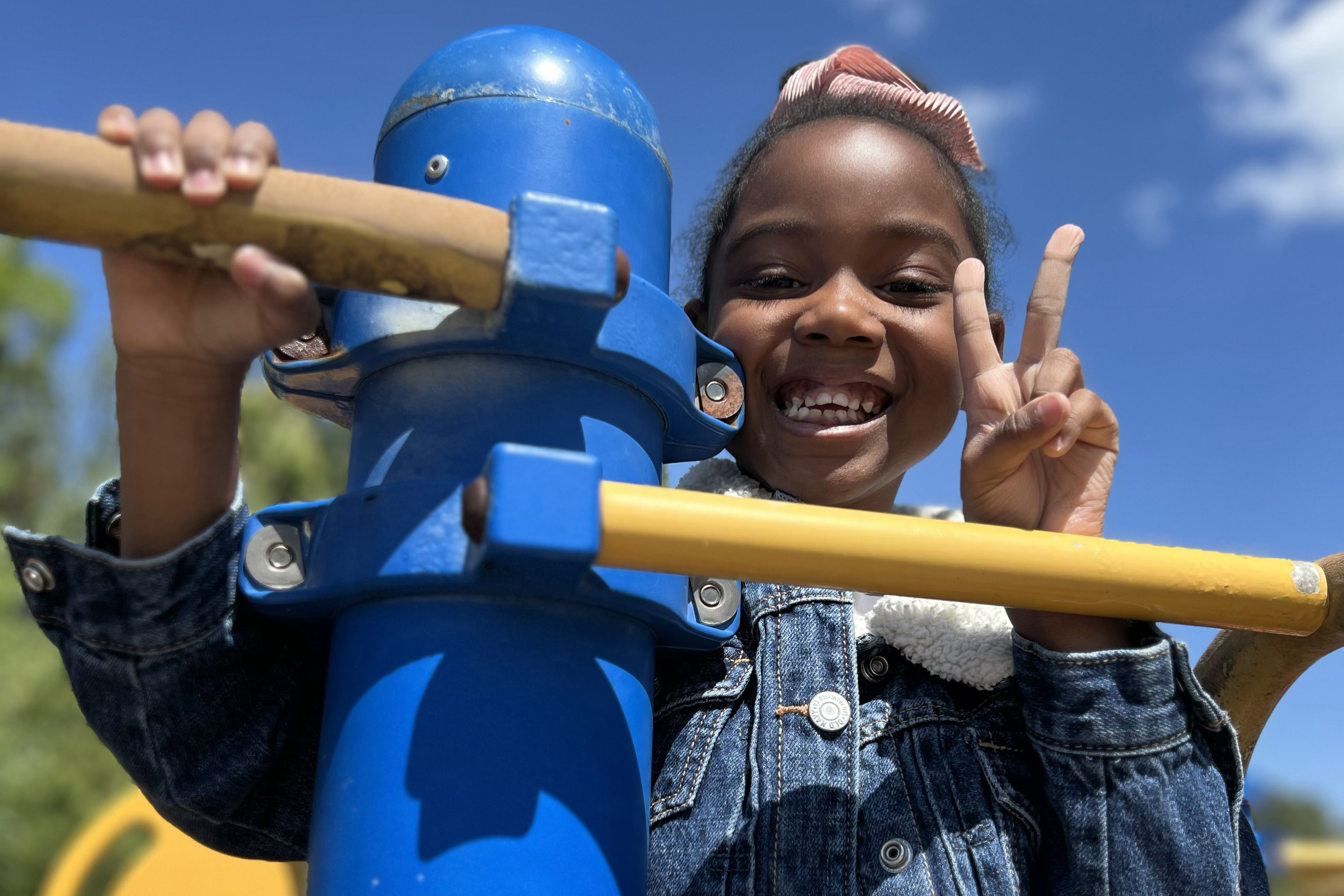 Female student on playground equipment