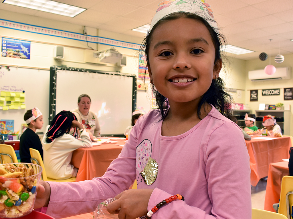 Female student smiles for the camera.