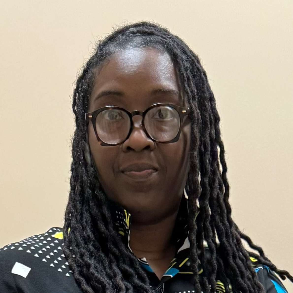 Coach Mitchell headshot wearing glasses and smiling