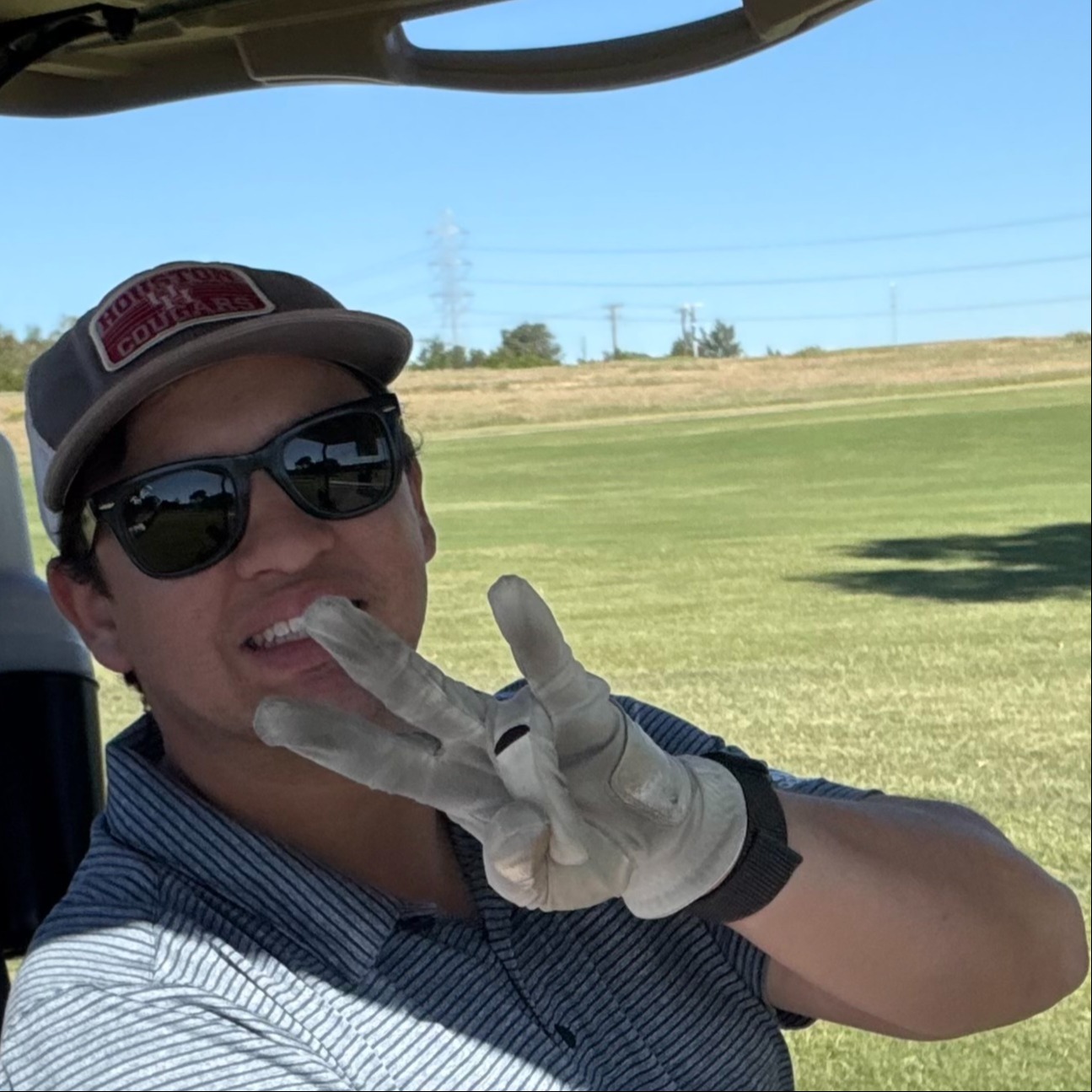 Robert Sturdy golfing representing U of H