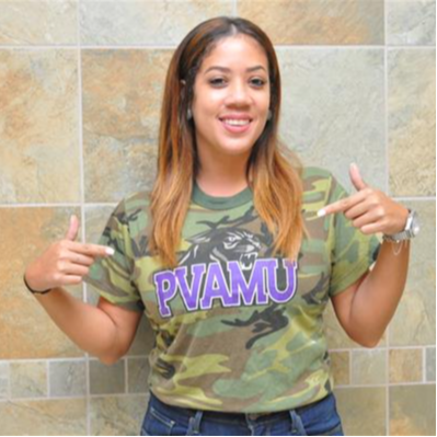 Kristina Lewis representing PVAMU wearing a camouflage shirt smiling