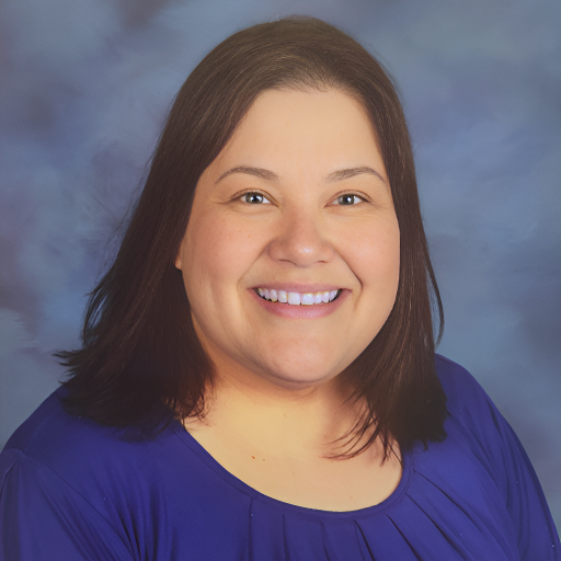 Caitlyn Layton smiling in her yearbook photo wearing a blue blouse with straight here 
