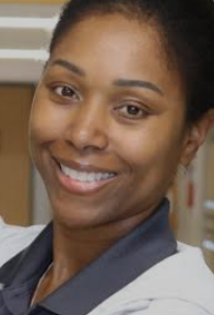 Andrea Gans smiling in the school hallway