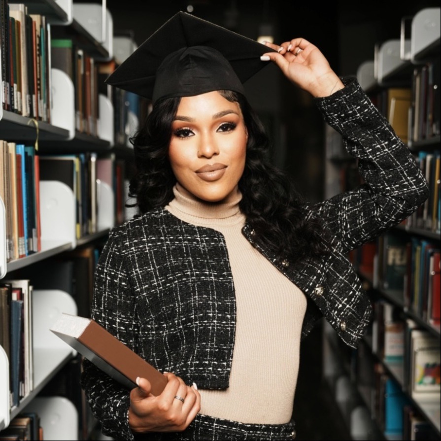 Headshot of T. Bailey's graduation in a library