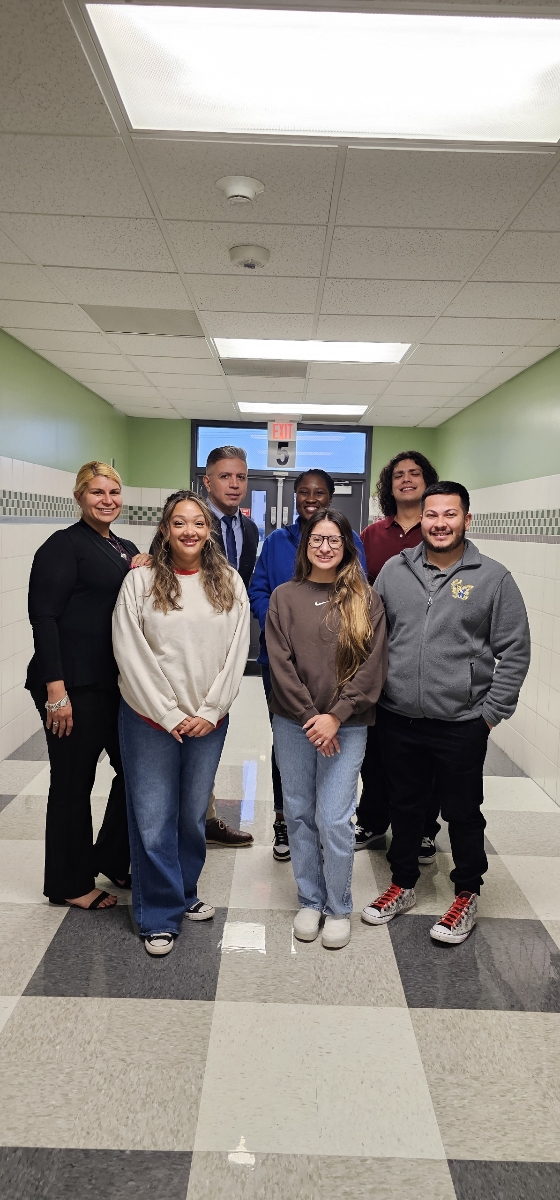 The fifth grade team stands together in the hallway of Hamblen Elementary School