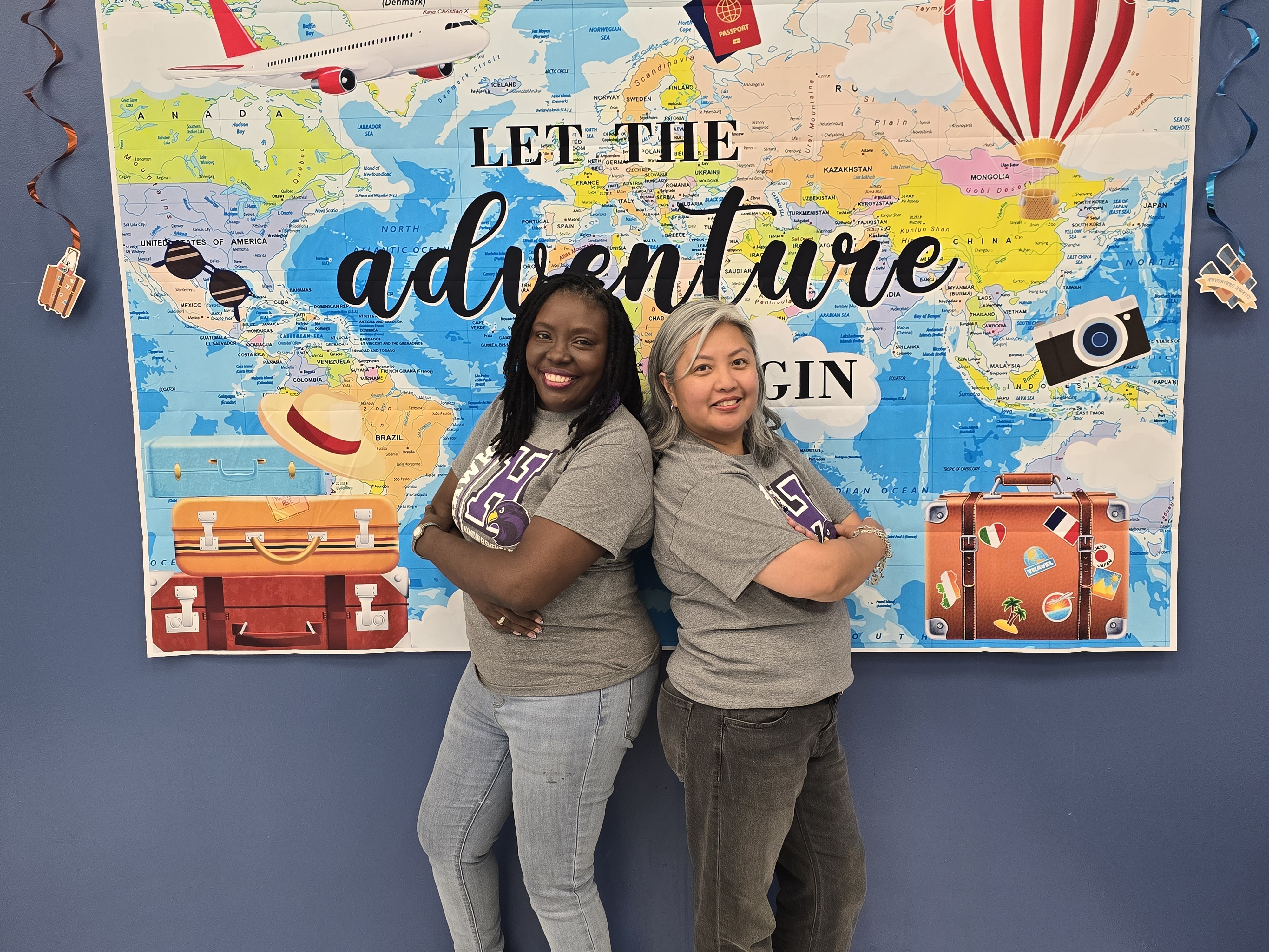 Hamblen Counselors, Valerie Baker and Hyacinth Natividad, strike a pose in front of our Adventure  backdrop