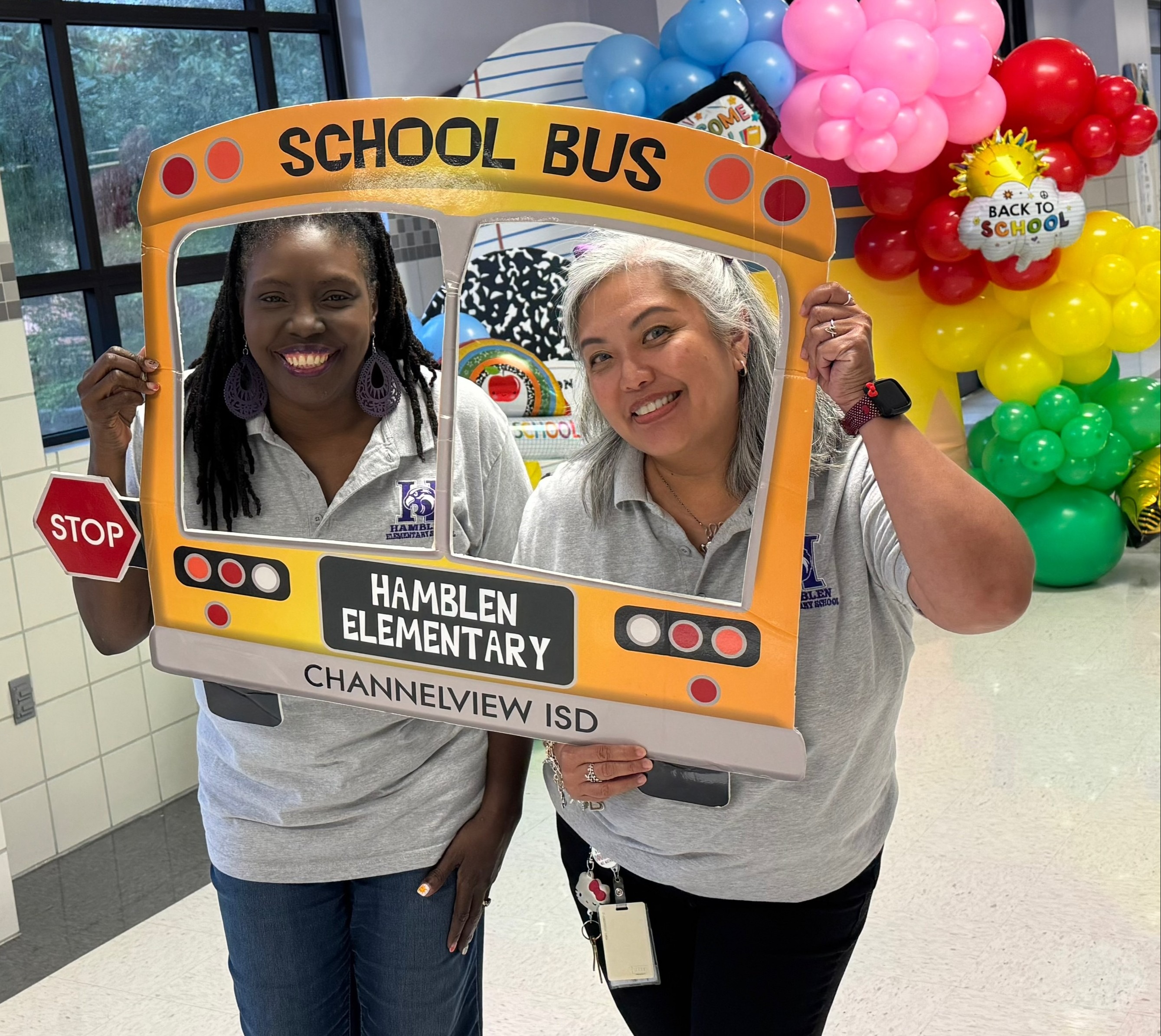 Hamblen Counselors, Valerie Baker and Hyacinth Natividad, strike a pose in front of our Adventure  backdrop