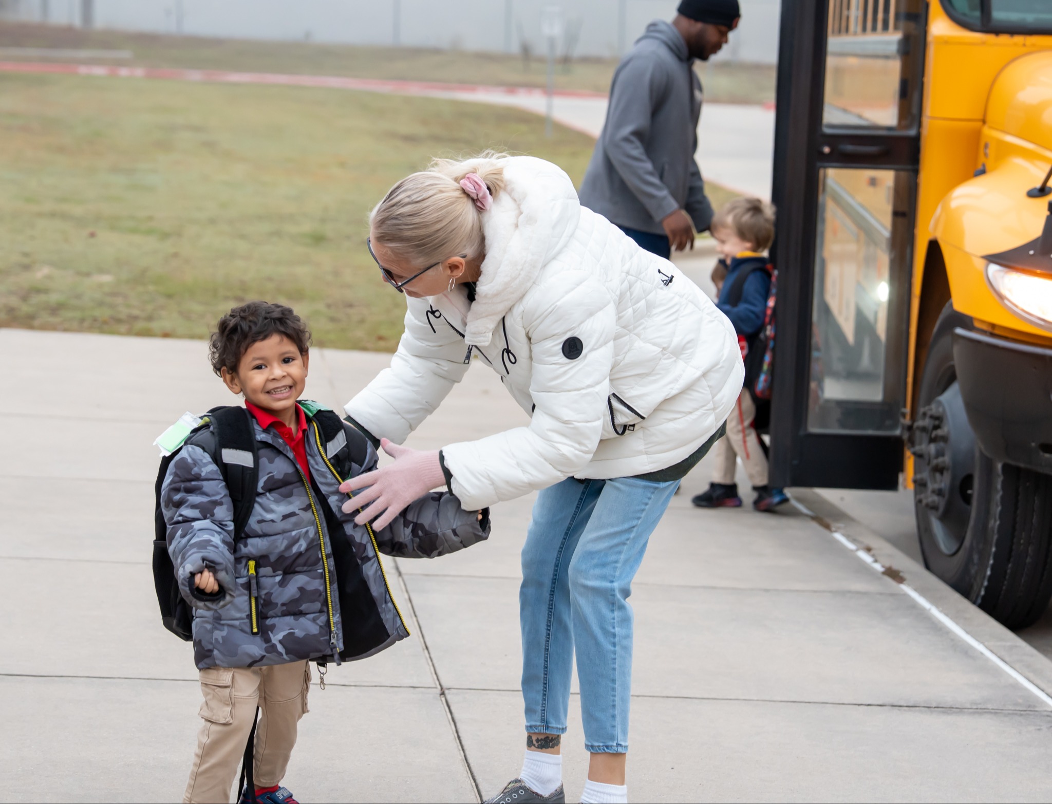 student getting off bus