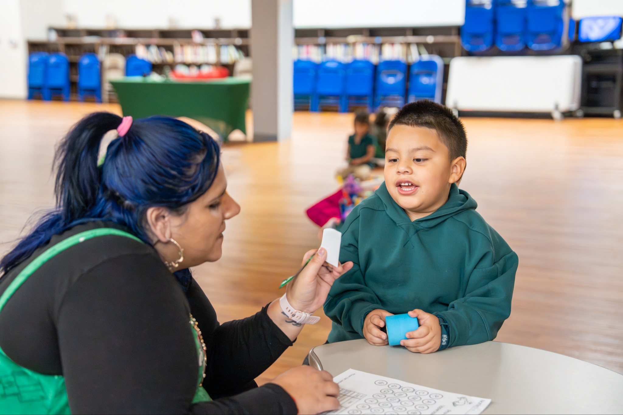 teacher working with student