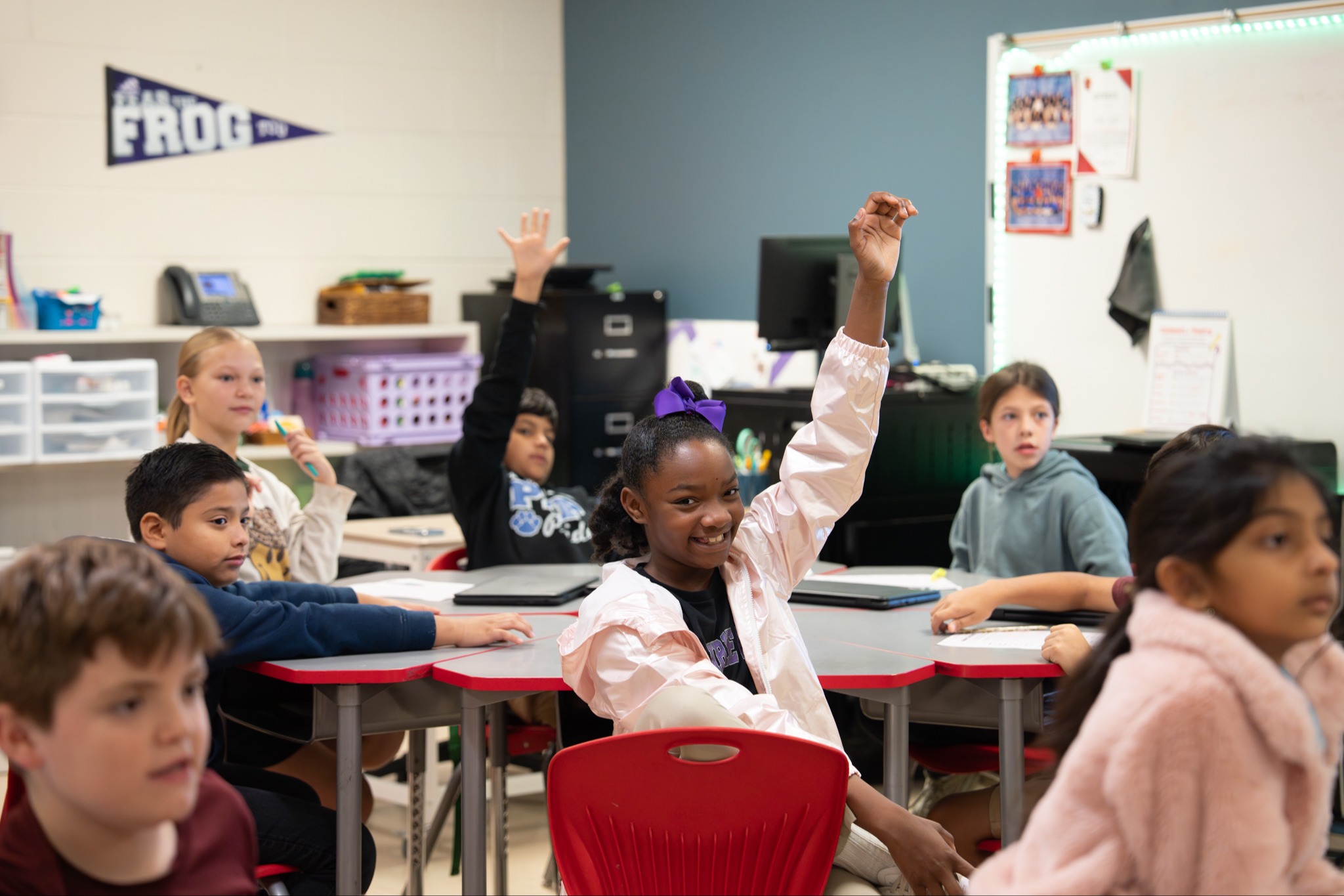 student raising hand