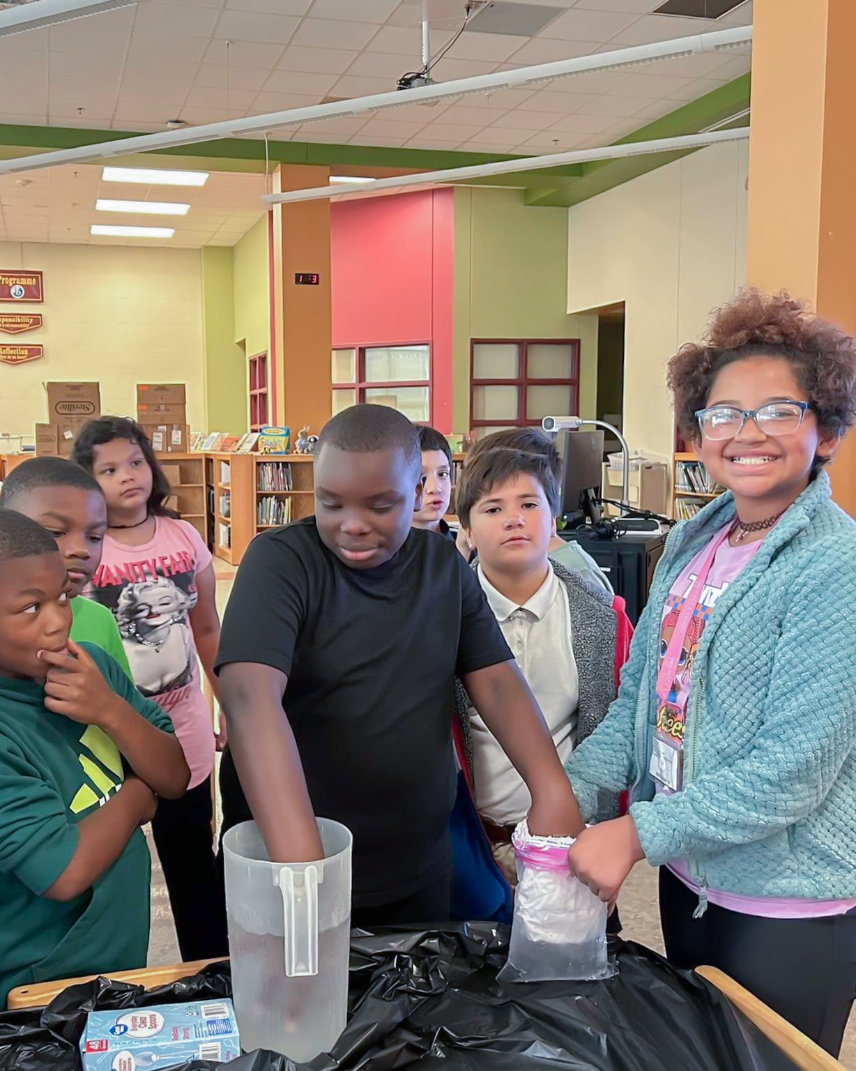 student participating in a science experiment 