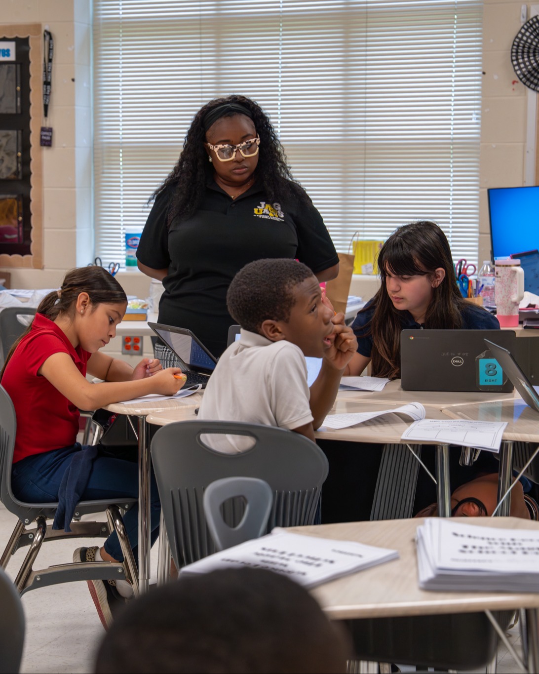 teacher supporting students