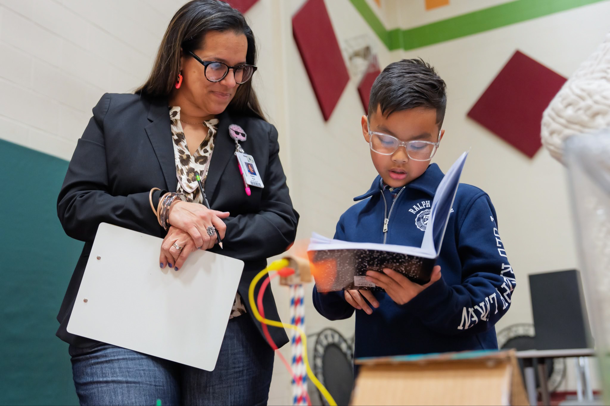 teacher supporting a student 