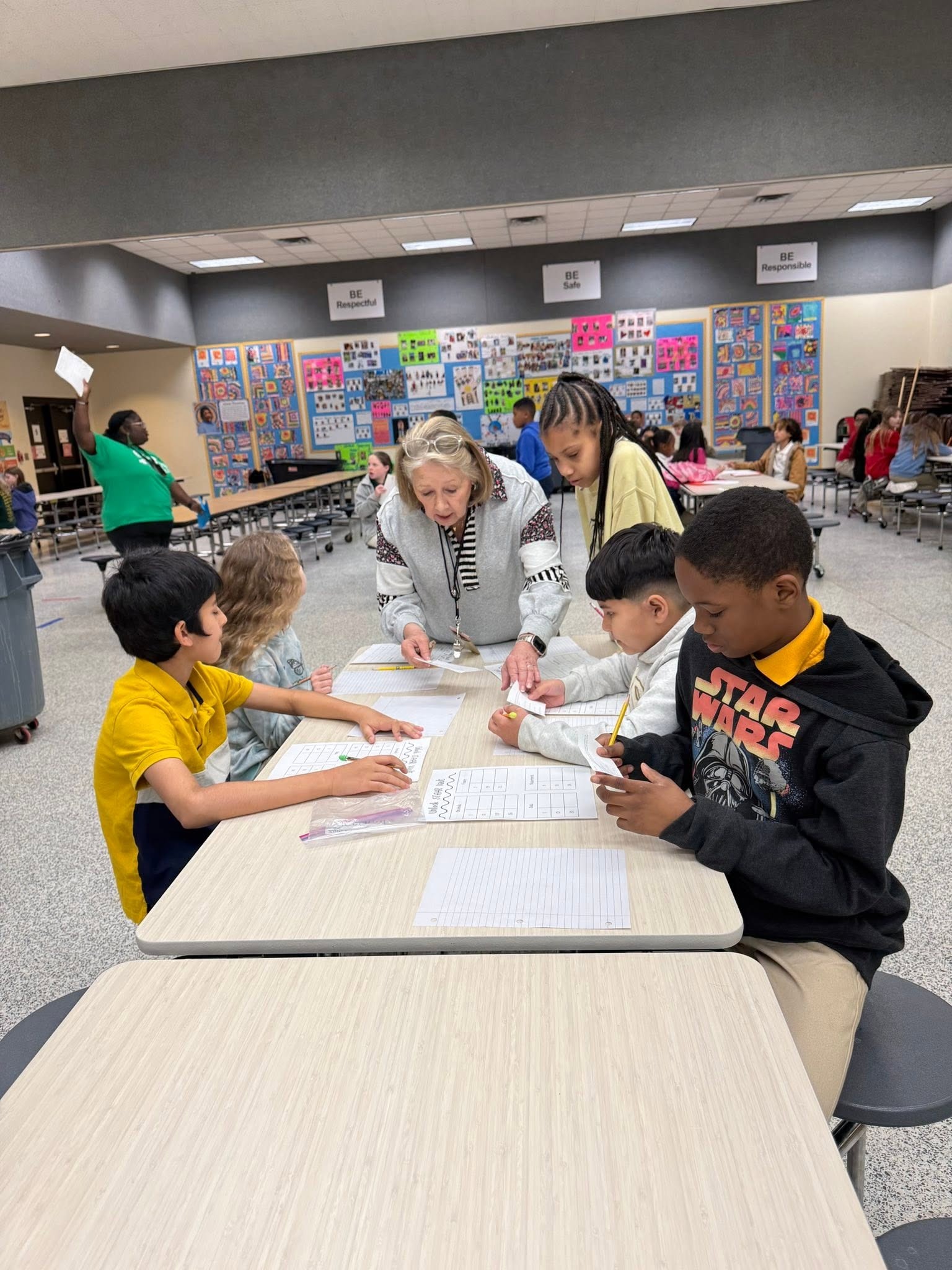 Teacher helping student