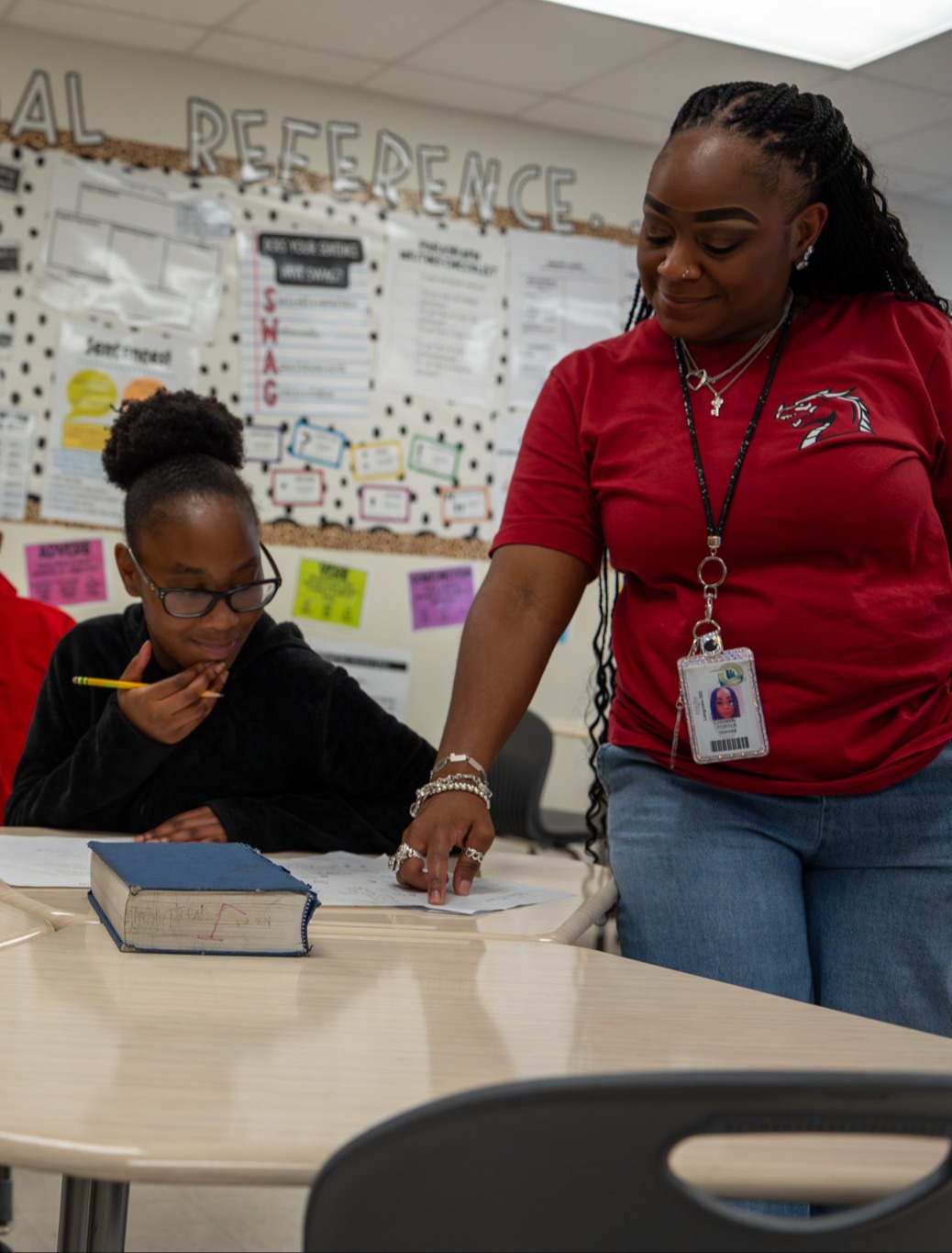 Teacher helping student