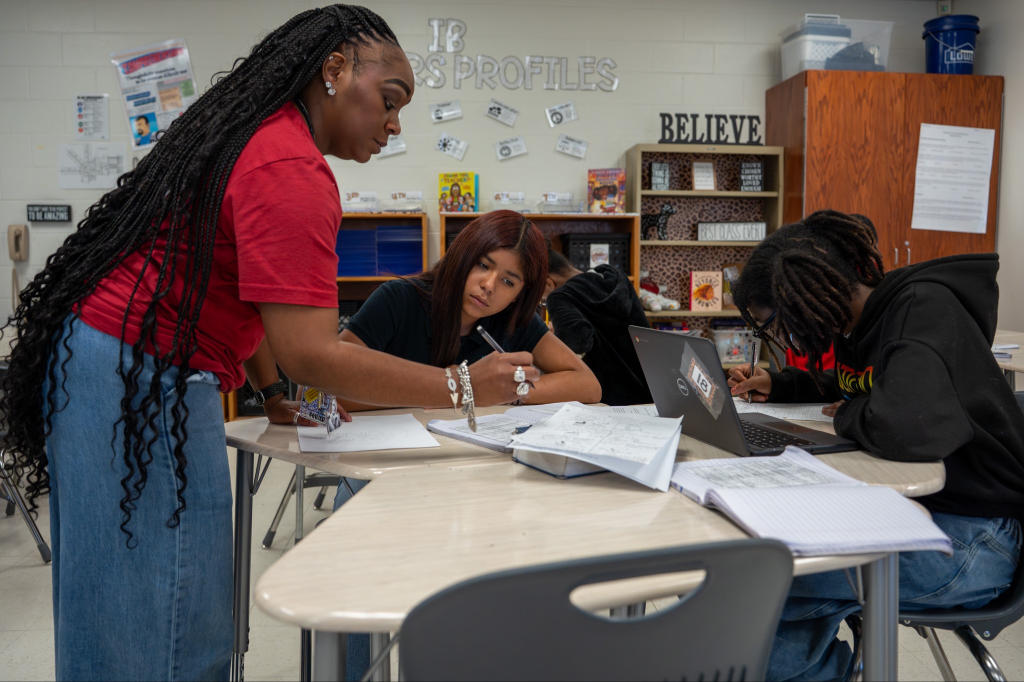 Teacher helping student