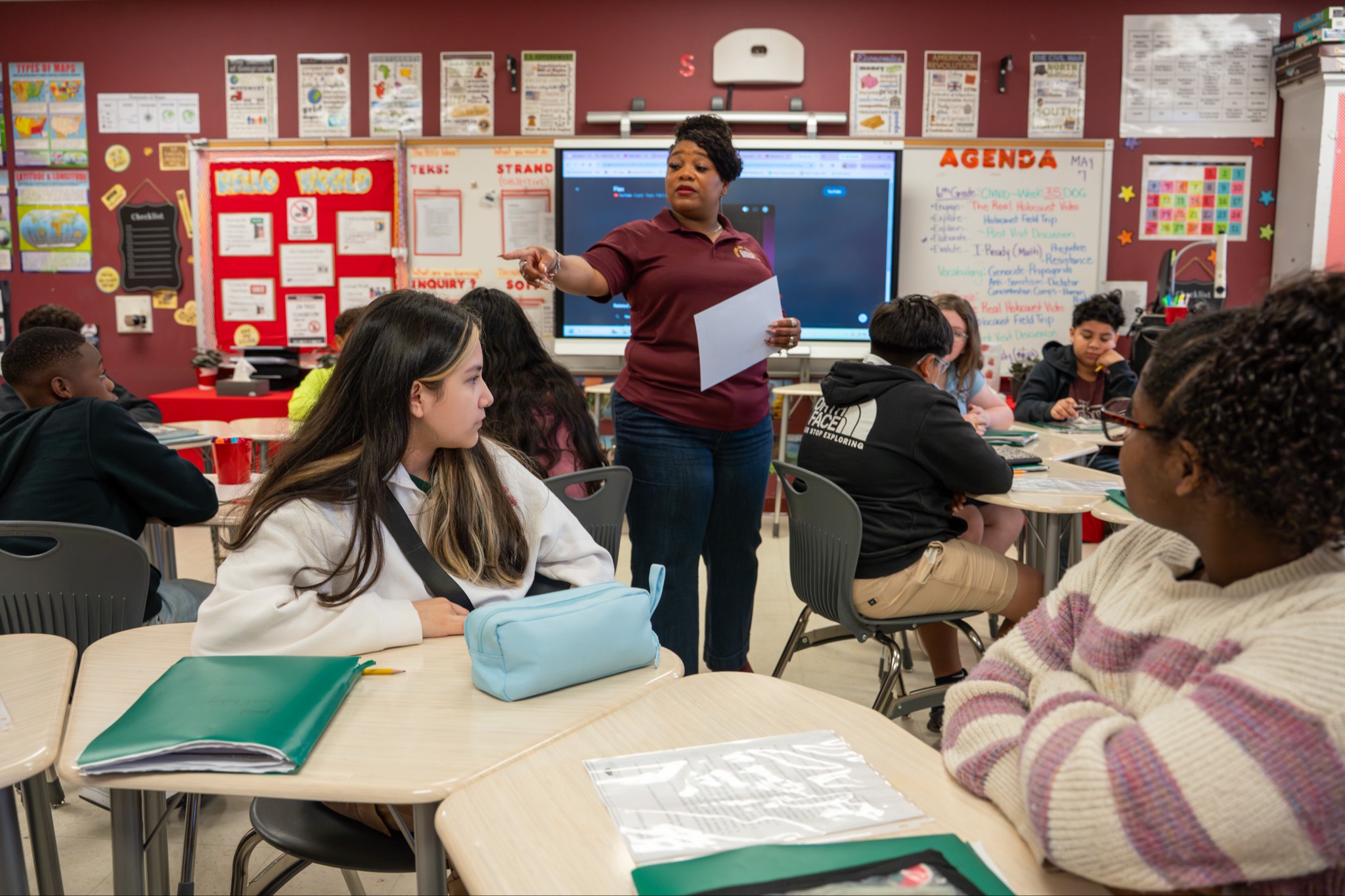 Teacher helping student