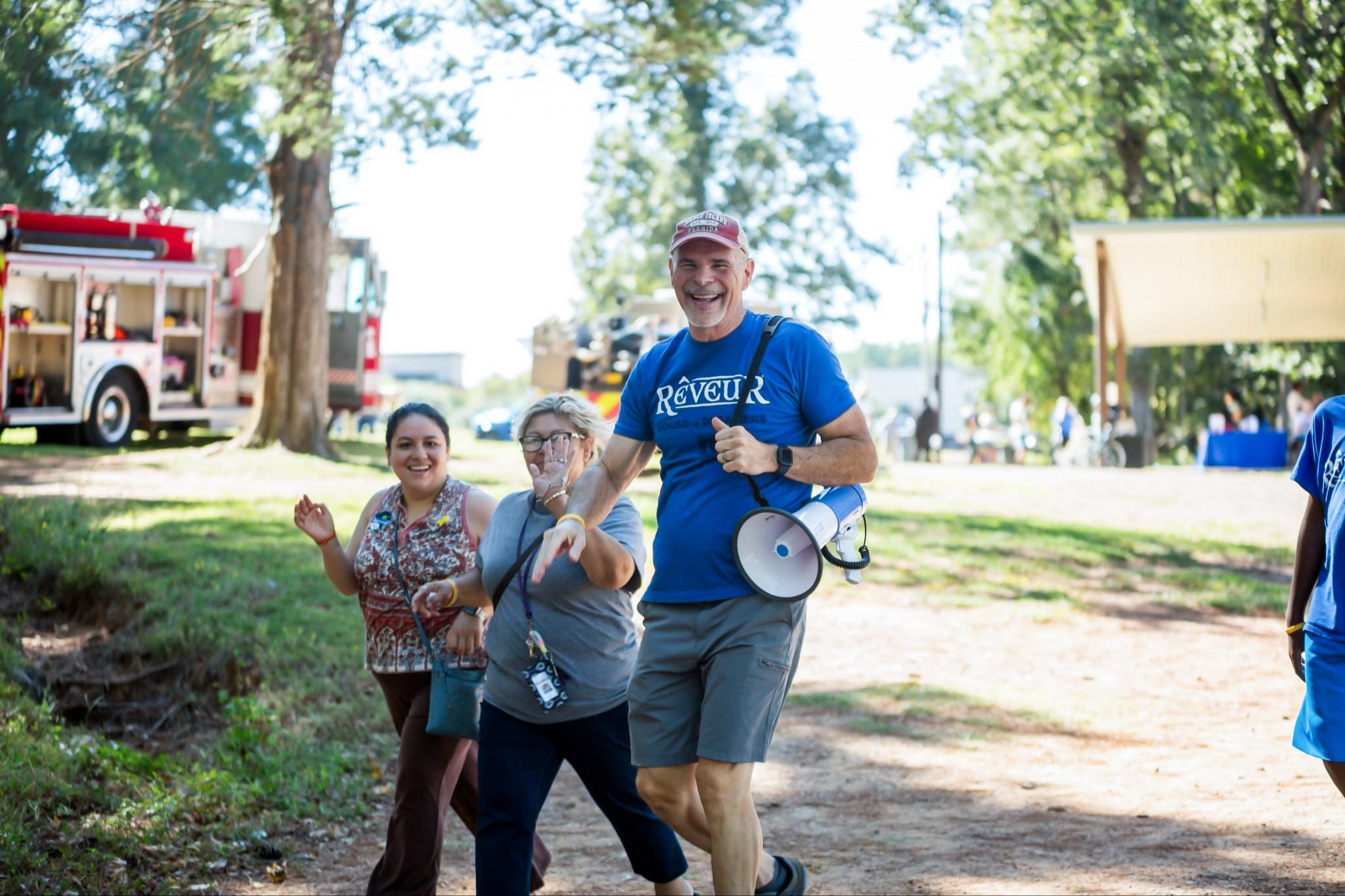 principal walking at community service event
