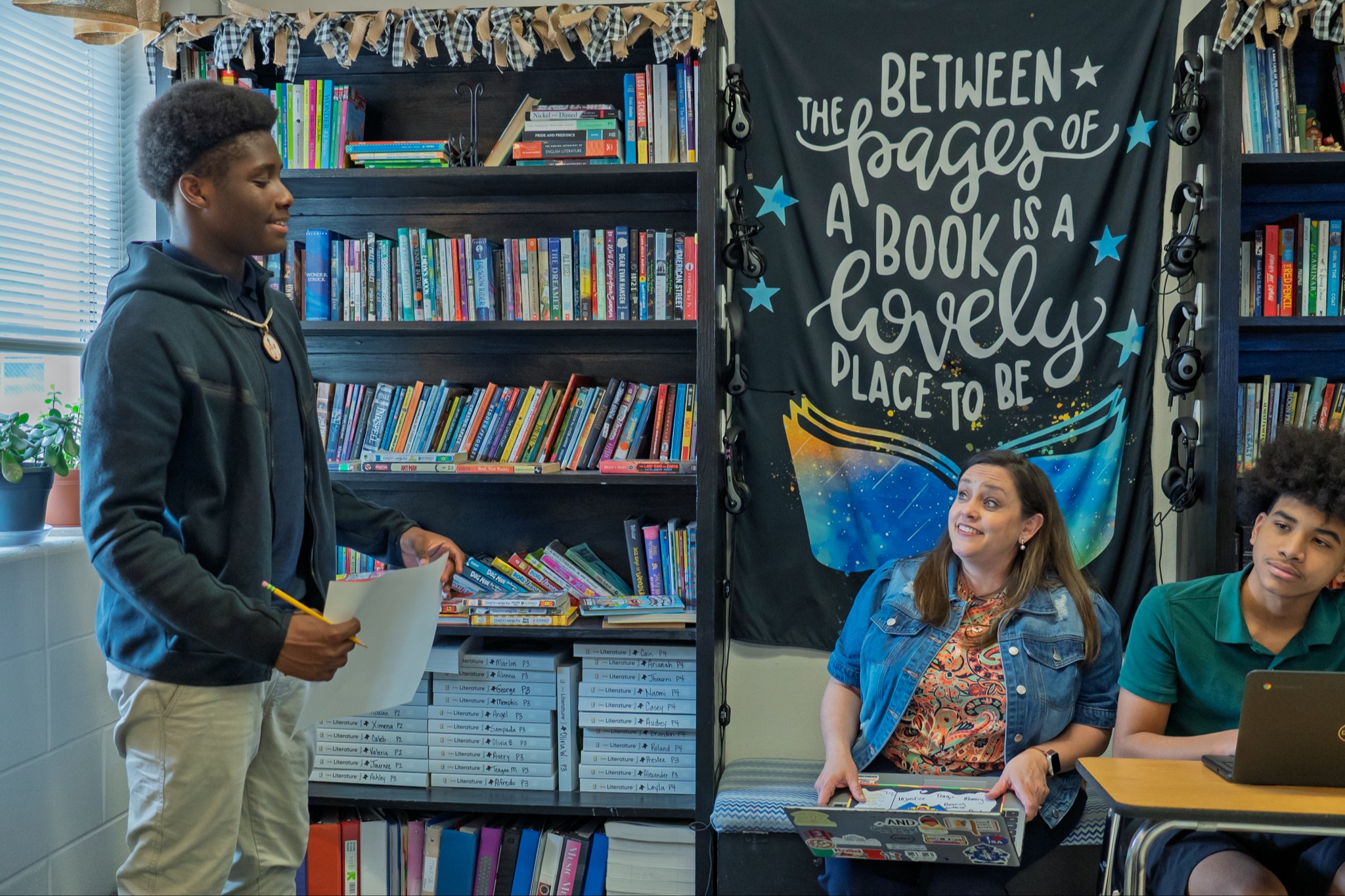teacher helping student 