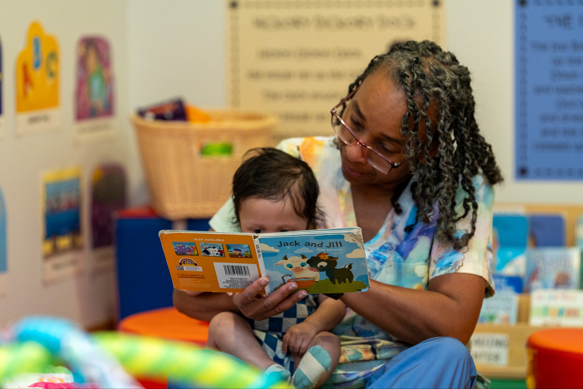 teacher reading to baby