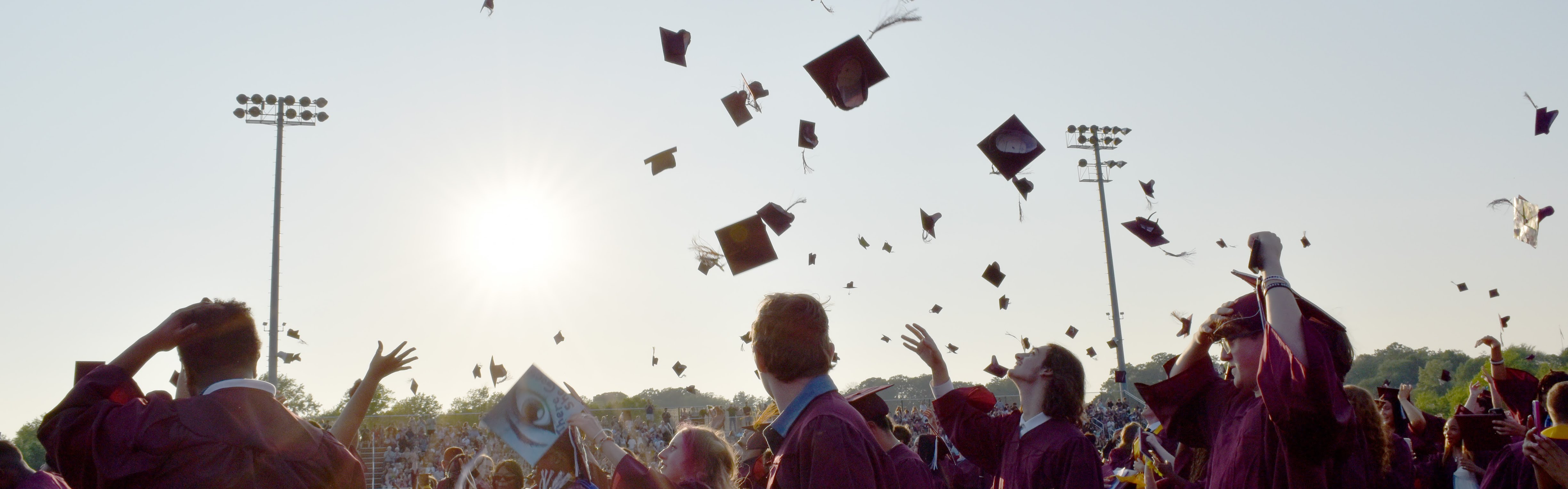 Graduates toss their caps at Commencement