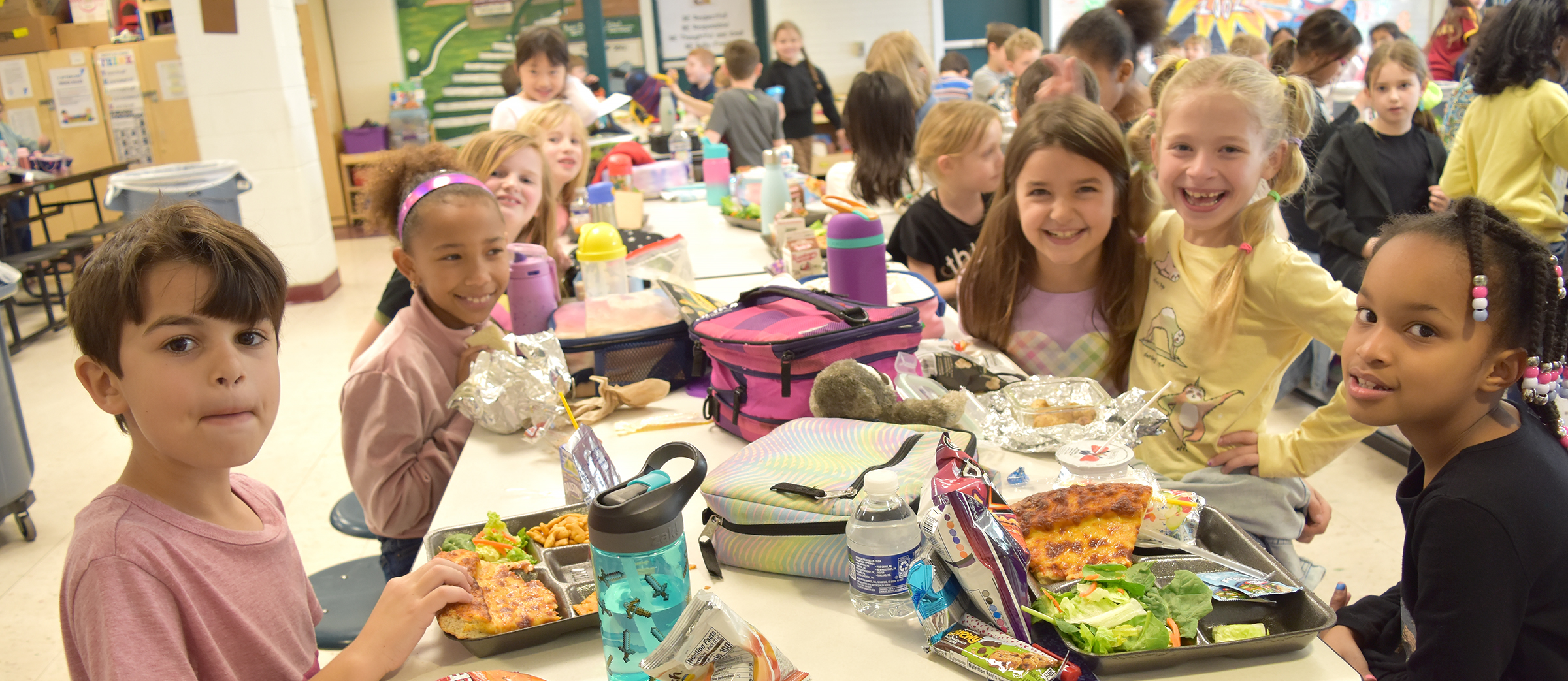 Students at Rydal Elementary School enjoy lunch with classmates.
