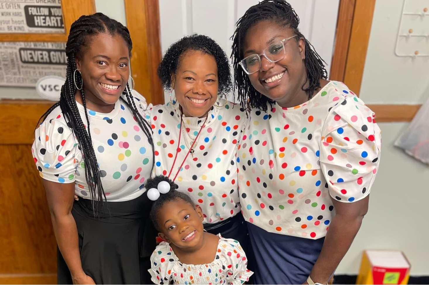 Three teachers and a student dressed the same
