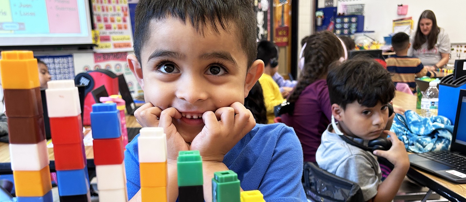 student playing with blocks