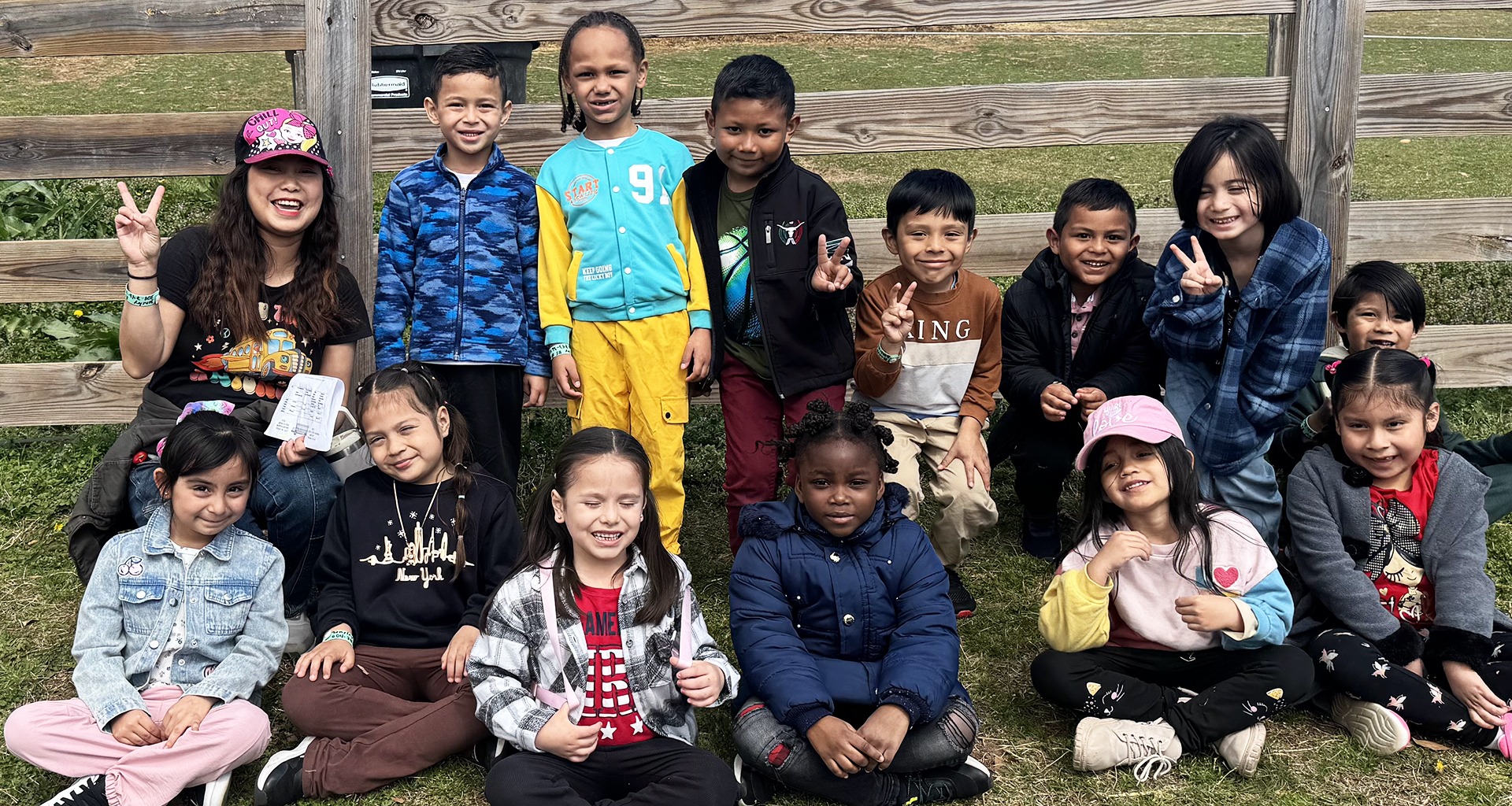 A group of students smiling during an outdoor activity