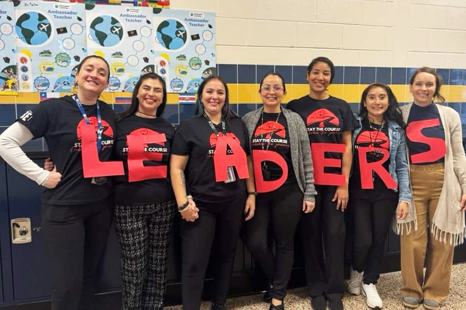 Teachers wearing shirts that spell leaders