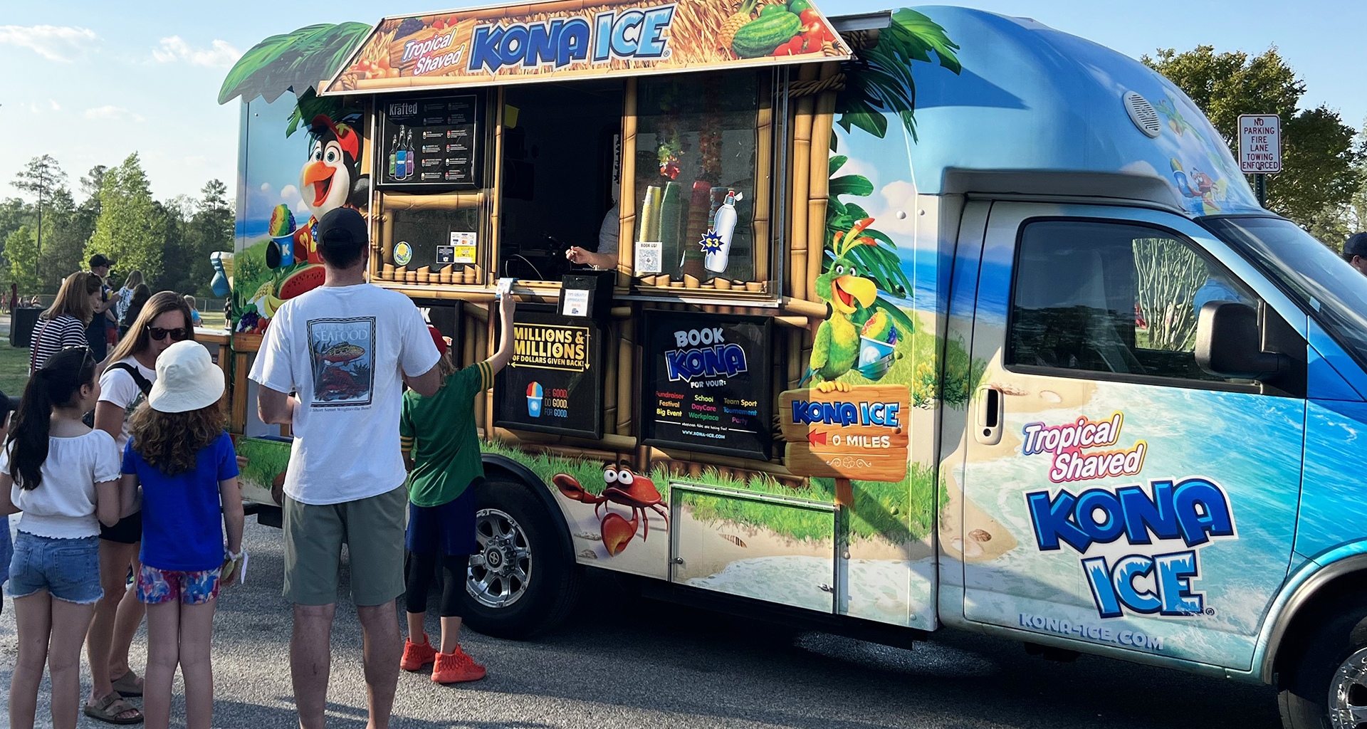 Students standing in line at the Kona Ice truck.